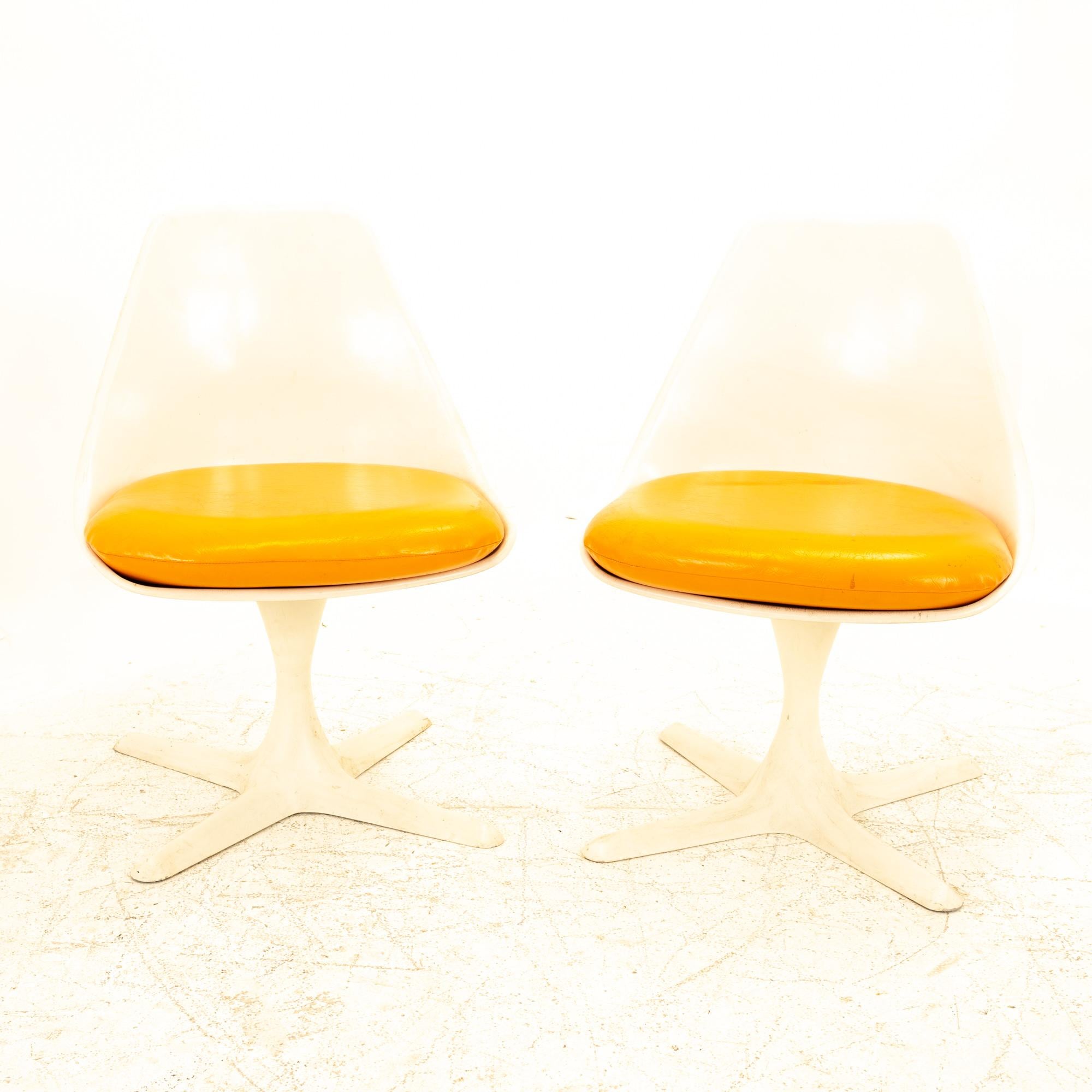 Burke Mid Century orange tulip chairs, pair

Each chair measures: 20.25 wide x 21 deep x 28.25 high, with a seat height of 15.75 inches

All pieces of furniture can be had in what we call restored vintage condition. That means the piece is restored