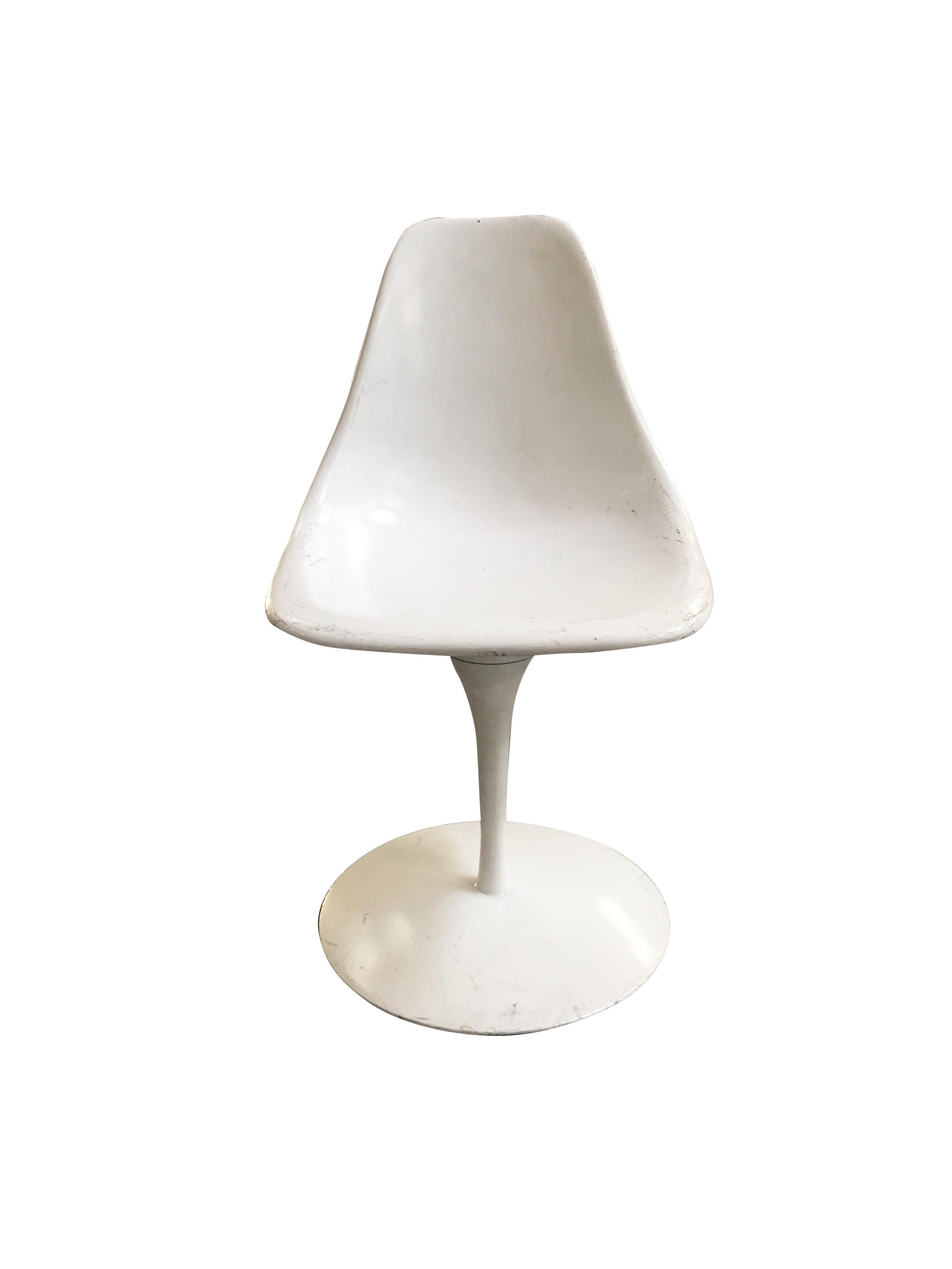 Modeled after Eero Saarinen's Tulip series, The Arkana shell chair was designed by Maurice Burke in 1965 for the Arkana company in England. It features the classic aluminum hourglass base and eggshell fiberglass seat that have remained a prime