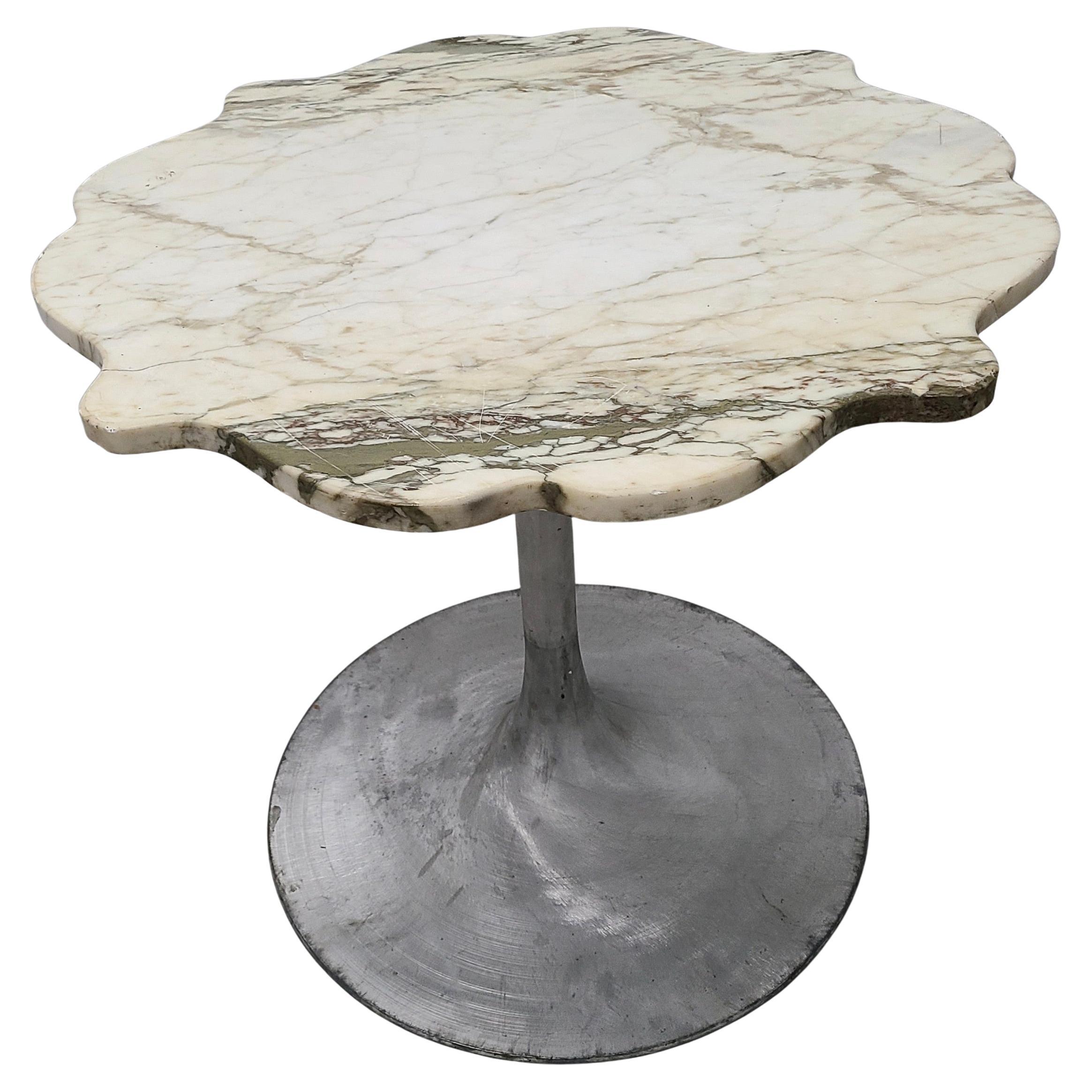 Please feel free to reach out for efficient shipping quote to your zip.

Dinette tulip table. 
Flower shape marble top.
Aluminum tulip base by Burke.

Note Continental table height is 3 inches lower than normal dining height.


Burke was sued by
