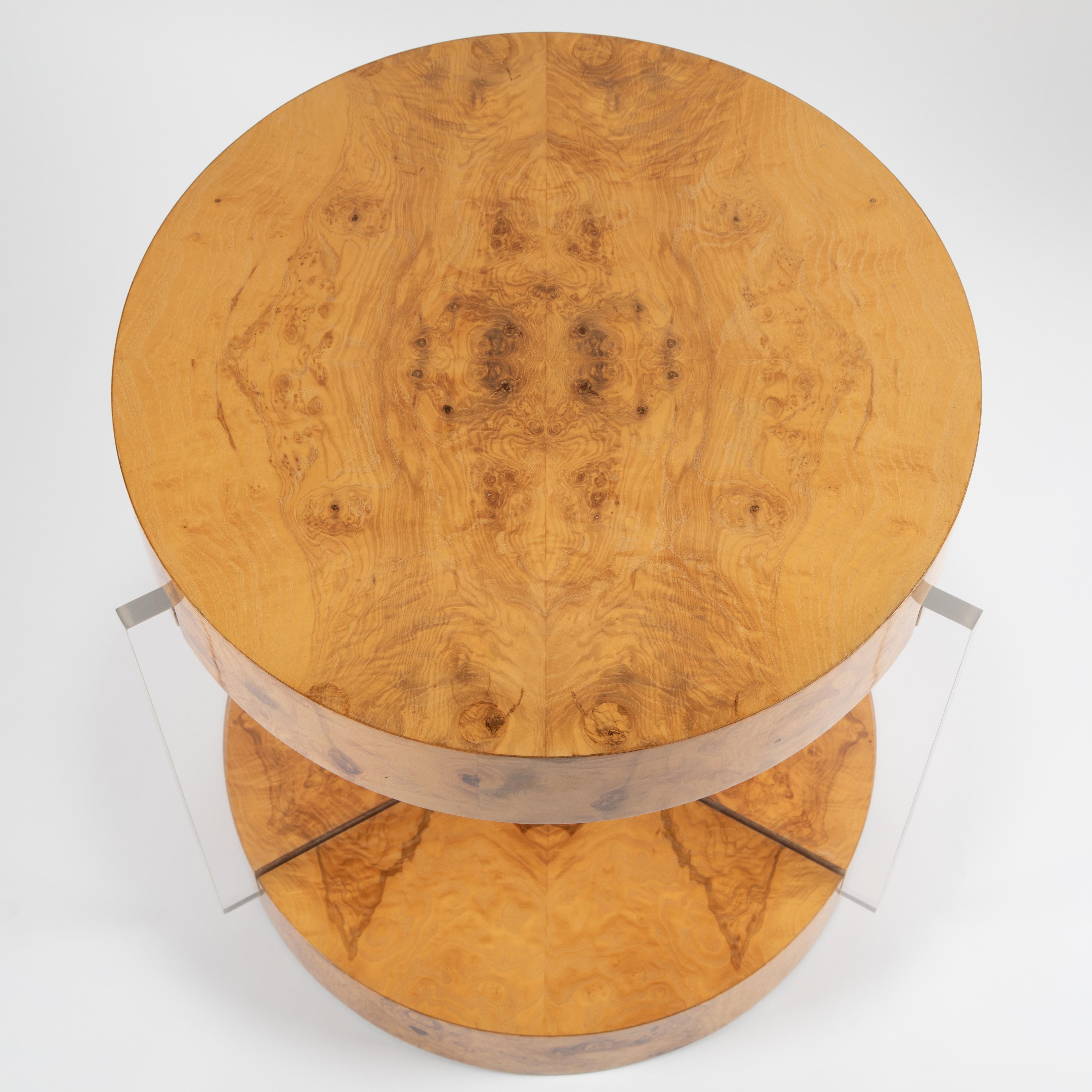 Stunning Vladimir Kagan center table features two tiers of expressive blond burl wood supported by three thick Lucite slabs. Quality construction.


