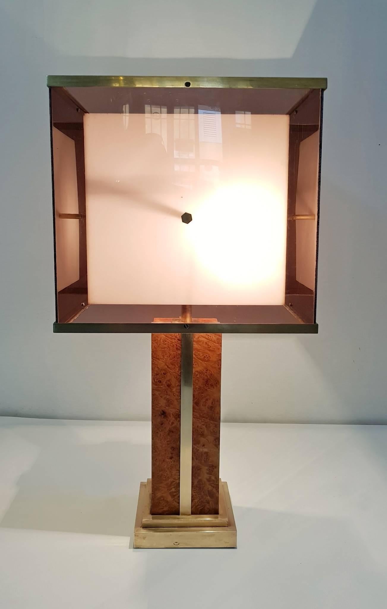 A lamp attributed to Romeo Rega with a base in burl wood and brass. As well as the original lampshade in two layers of plexiglass with the inner one being white and the outer in a smokey color which gives great Ambience when lit. In excellent