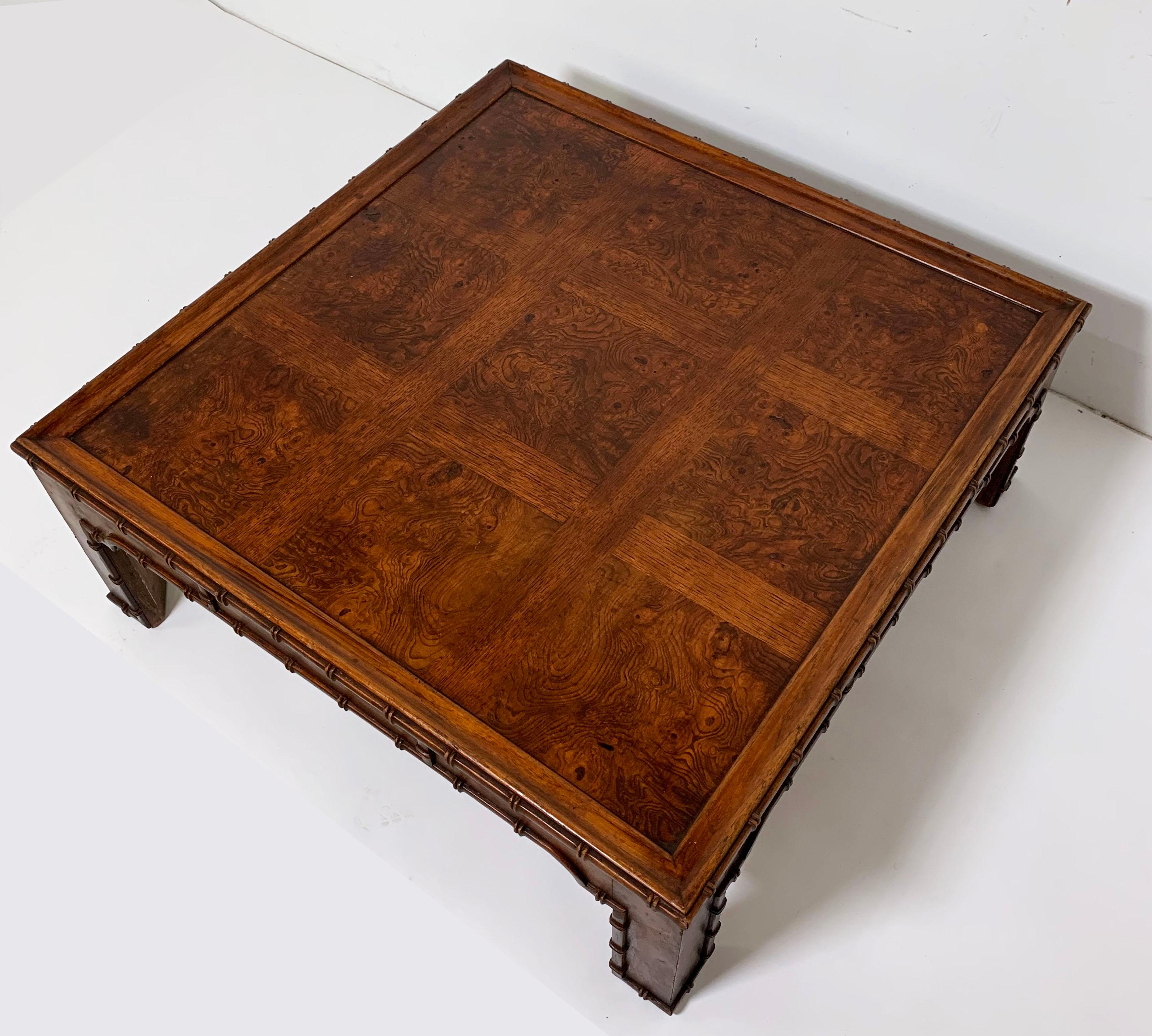 Midcentury burl wood and walnut coffee table in the Classic English Regency style by Heritage Furniture, circa 1970s.