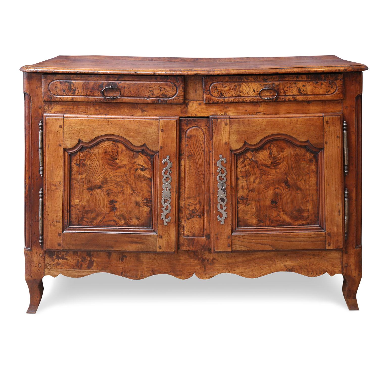 Burl ash French buffet, circa 1860, with two dovetailed drawers, two shaped panel doors above a shaped lower edge, an interior shelf and working locks with a key.