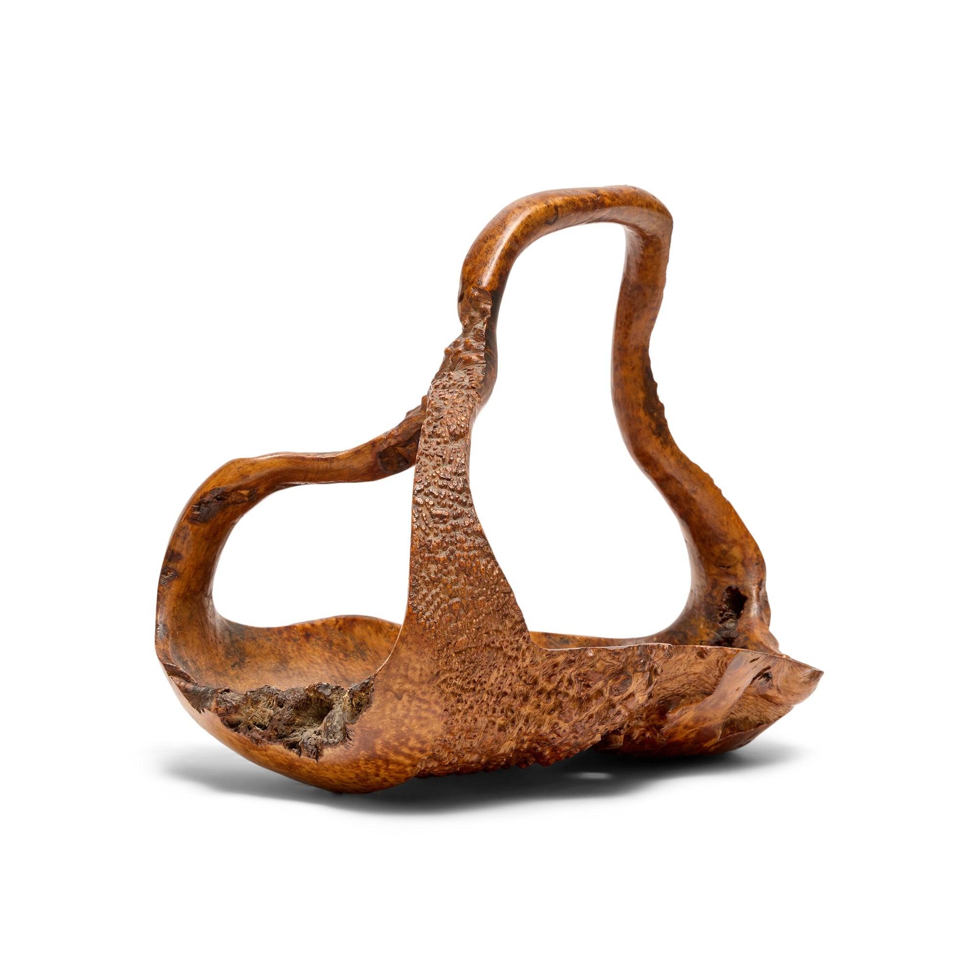 An extraordinary burl basket carved from one piece of wood.