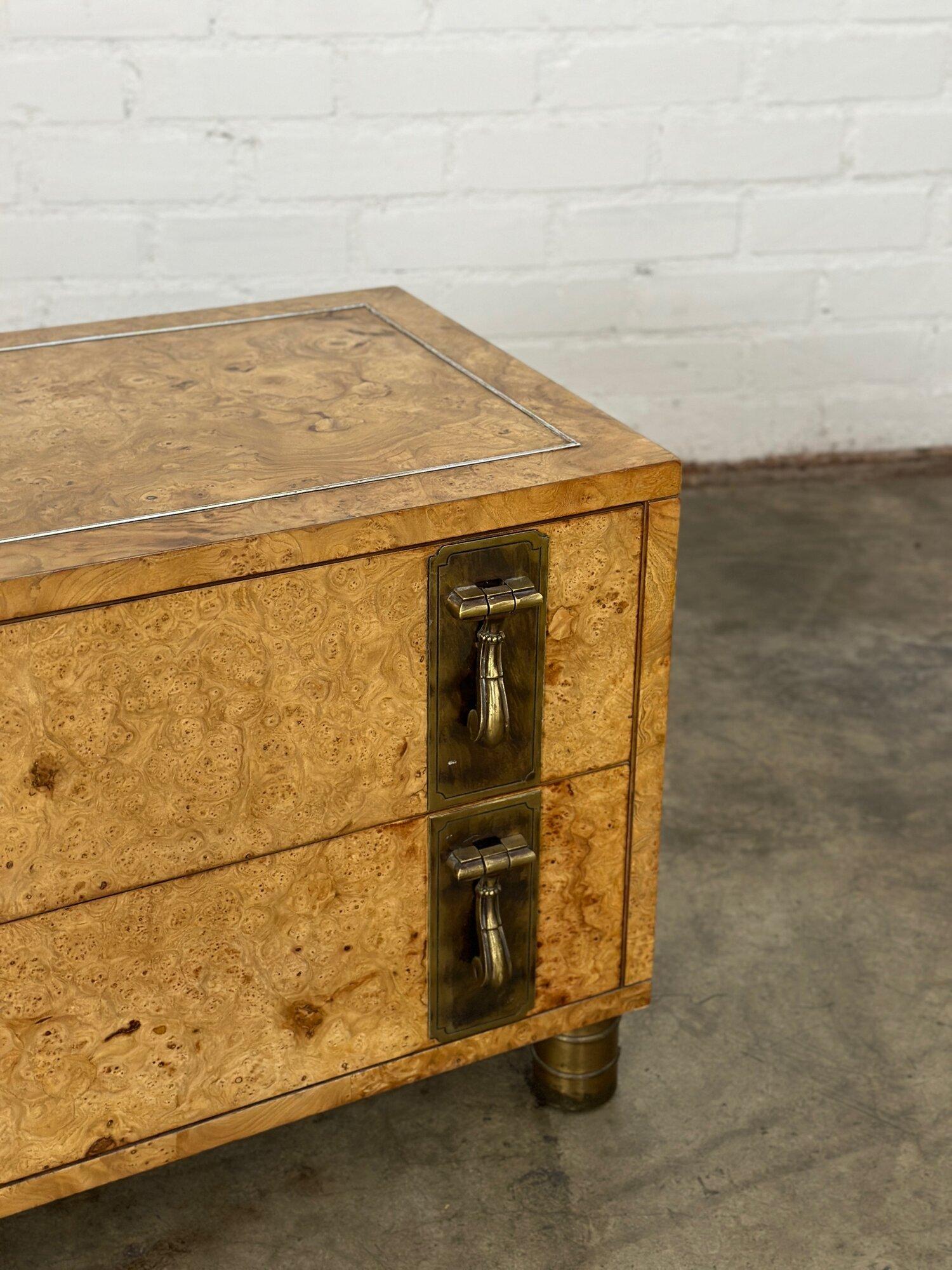W33 D19 H22

1970’s Fully refinished Burl wood chest of drawers by Mastercraft. Item features two drawers with brass pull hardware. Sits on four cylinder brass legs. 