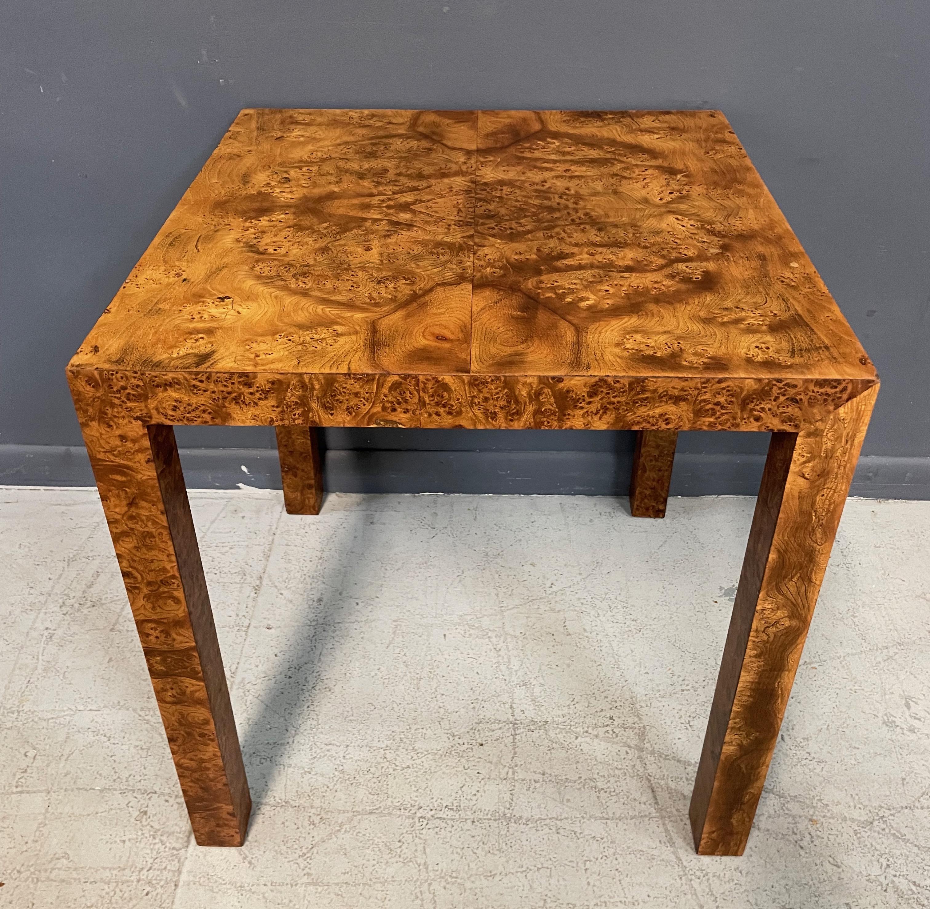 Beautiful burl olivewood parsons table that will grace many rooms and situations. Wonderfully figured burl covers this table and will make a handsome addition to any project.