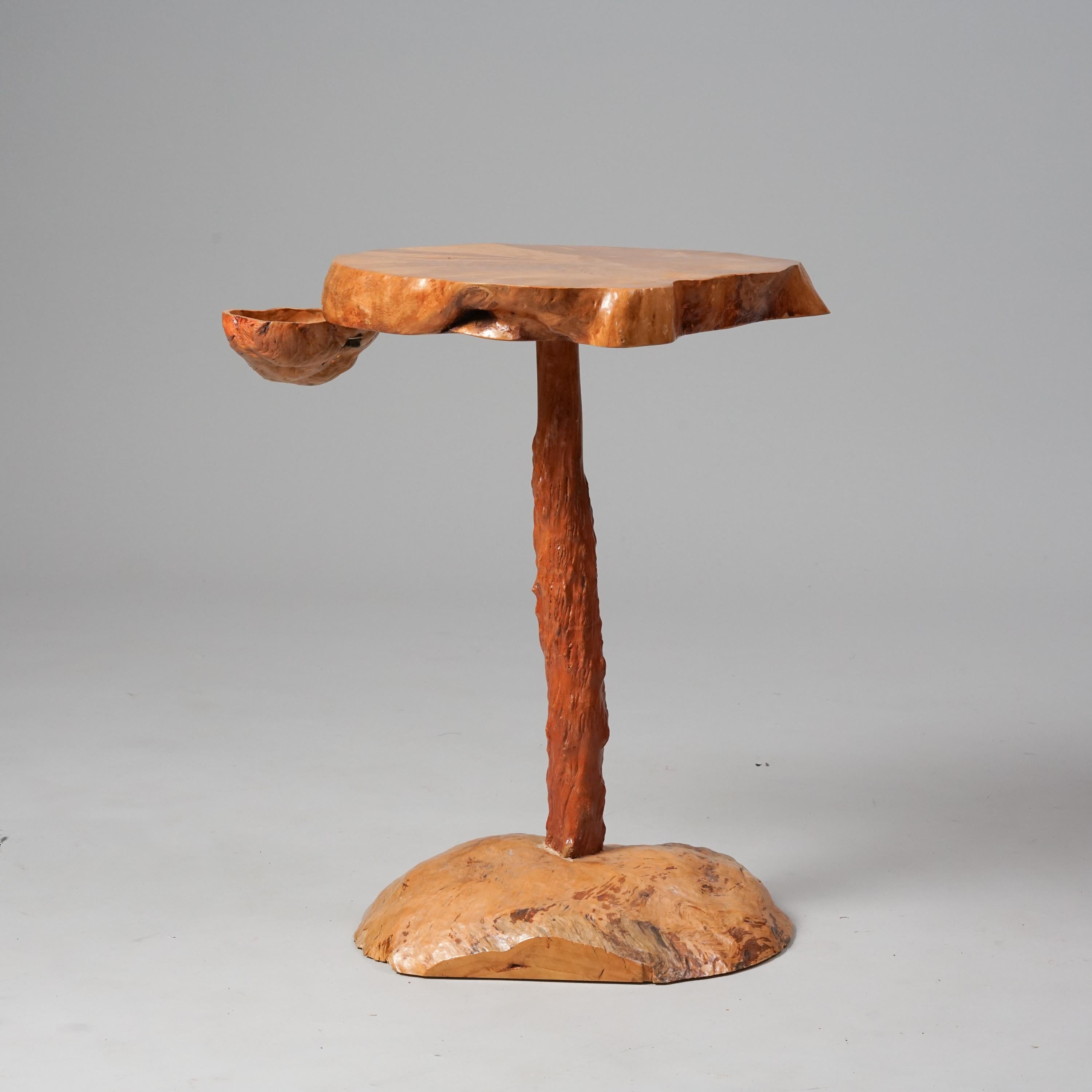 Burl table from the Mid 20th Century. Swivel cup underneath the table top. Good vintage condition, minor patina consistent with age and use. Unique design.