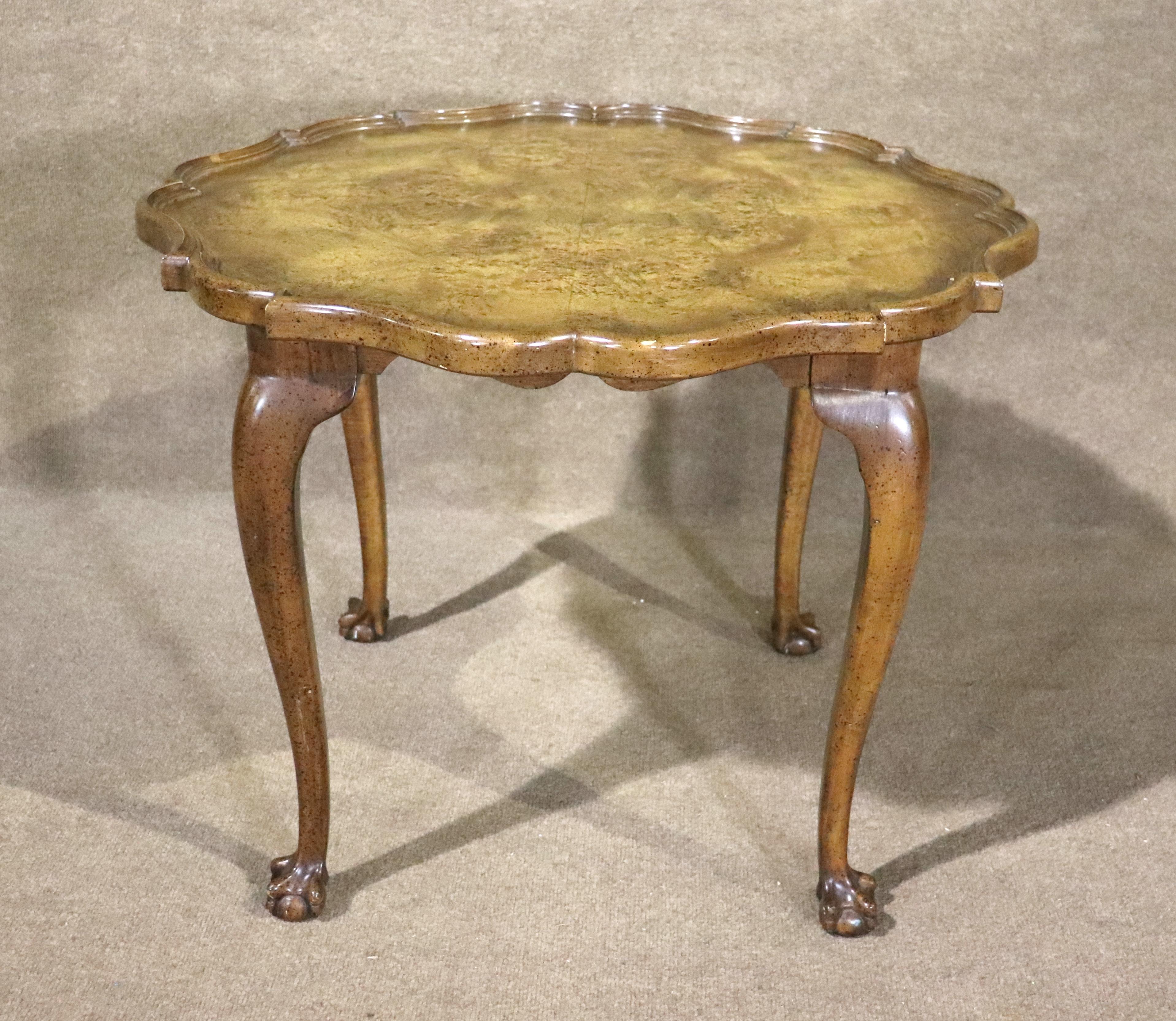 Antique side table with brilliant burled walnut top and claw foot legs.
Please confirm location NY or NJ