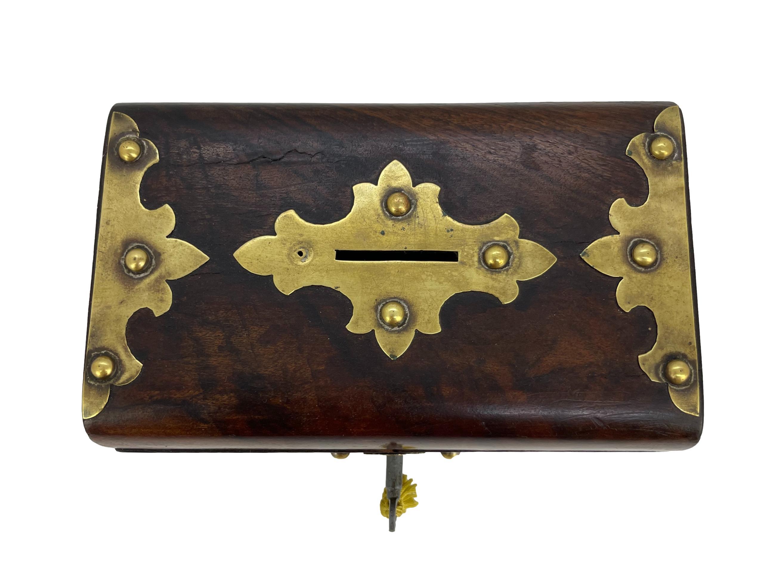 Burl walnut Money Collection box with tacked brass plates and escutcheon plate, with slotted top, with orginal lock and key.
  