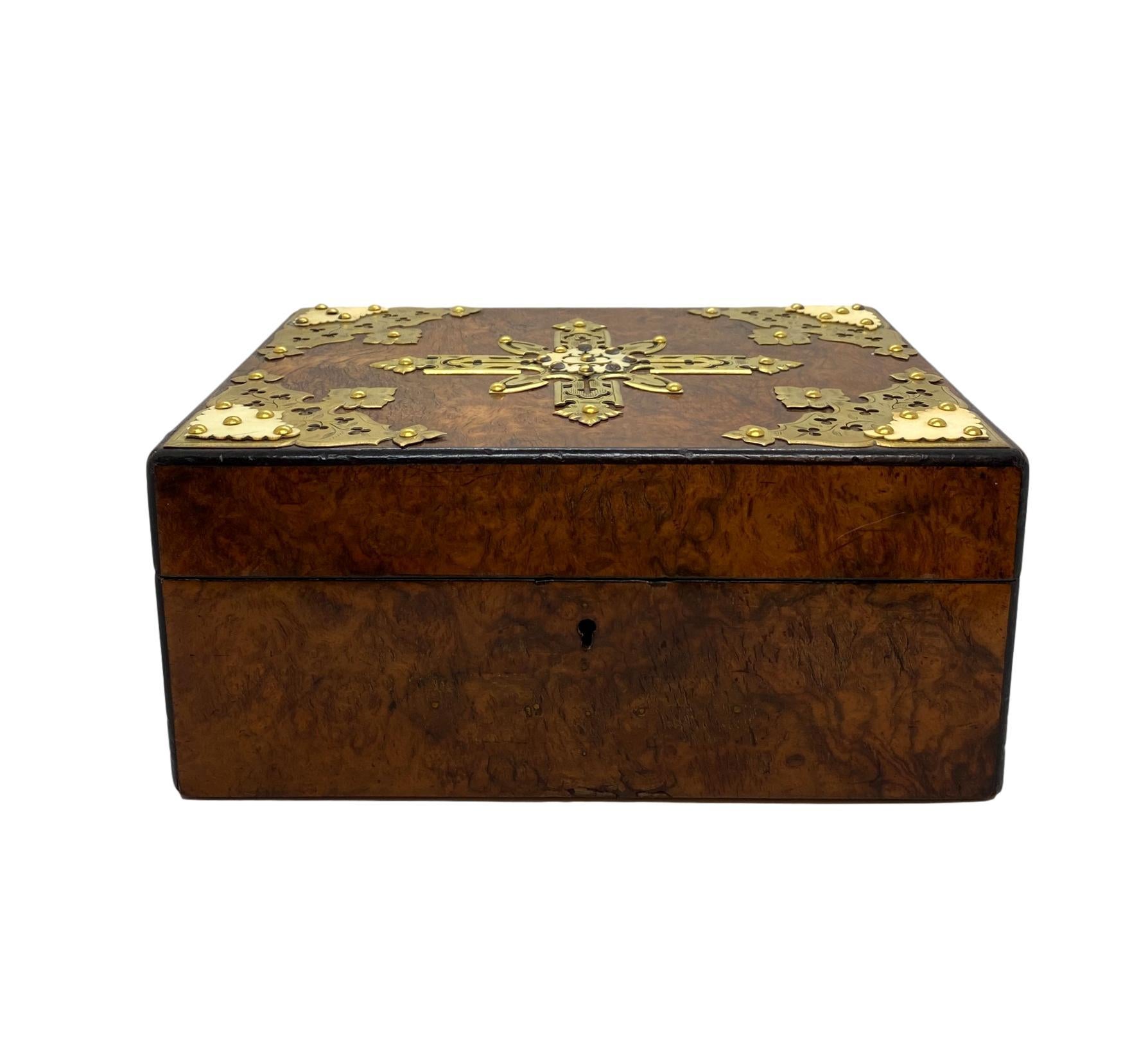 Burl walnut Ciar box humidor with intricate brass tracery, English, circa 1880.

Dimensions: D 7.75”, W 10.75”, H 4.75”.