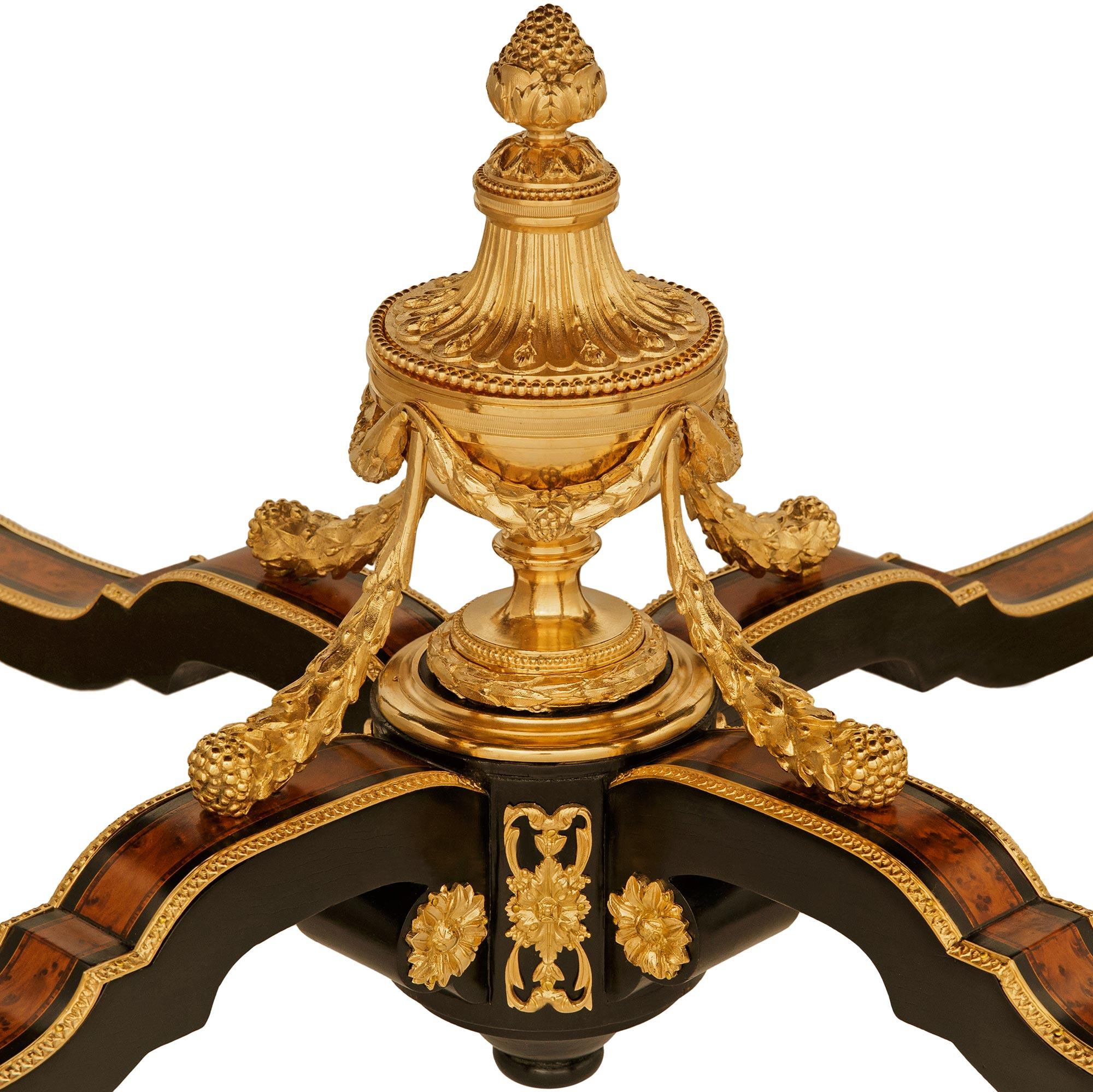 Burl Walnut, ebonized Fruitwood, Maple and Ormolu center table In Good Condition For Sale In West Palm Beach, FL