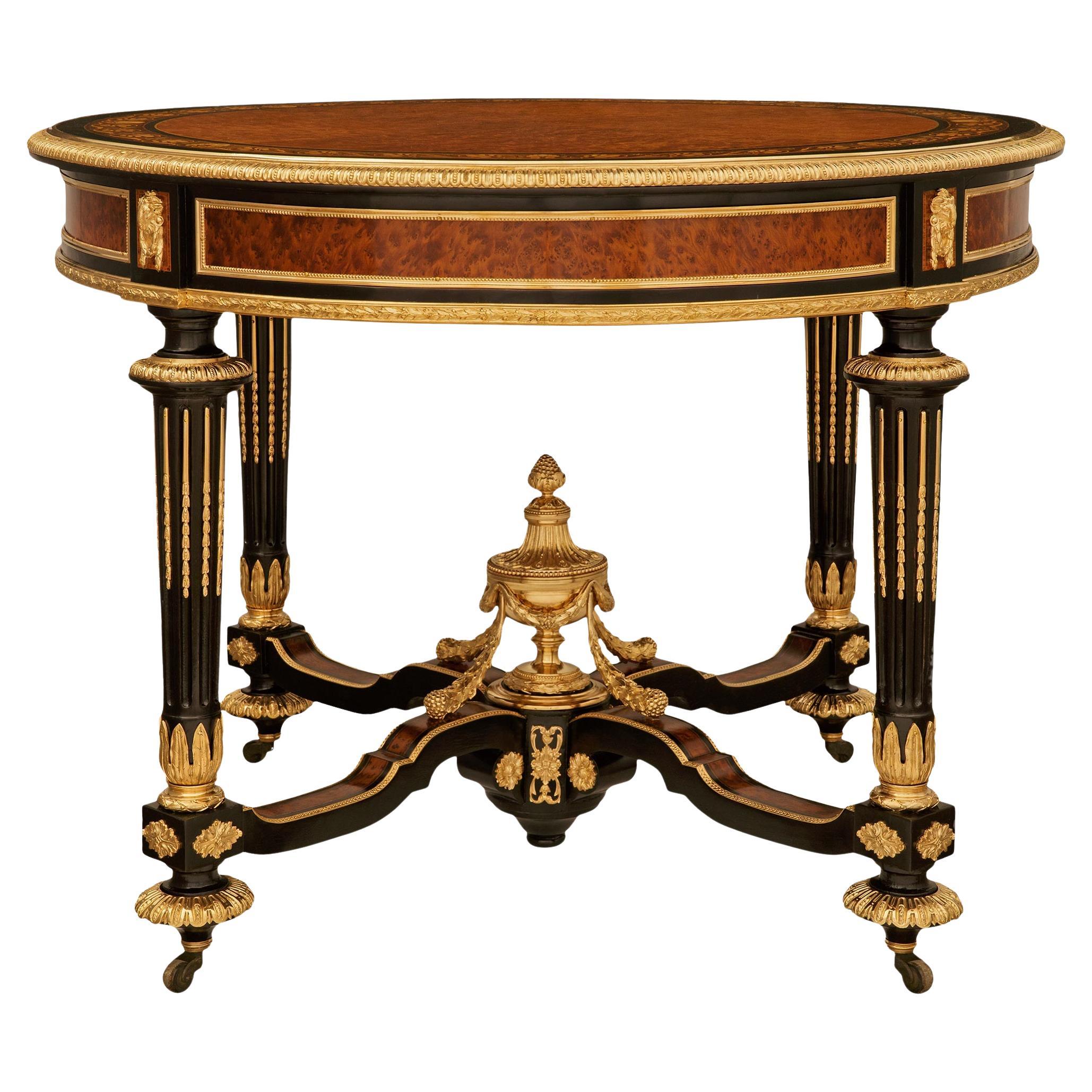 Burl Walnut, ebonized Fruitwood, Maple and Ormolu center table For Sale