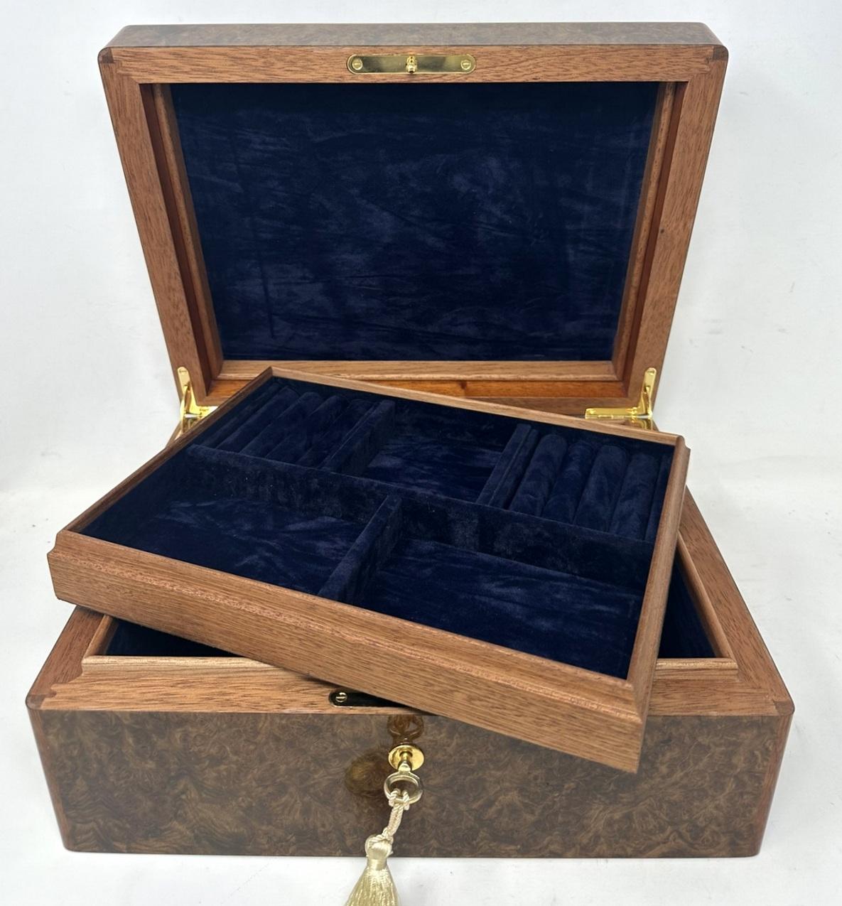 Stunning Burl Walnut Casket was manufactured by the famed Manning  Co. of Ireland  and is truly a jewel of handcrafted genius. This box is constructed of the finest woods available and the knowledge and skill of 4 generations of box making in the