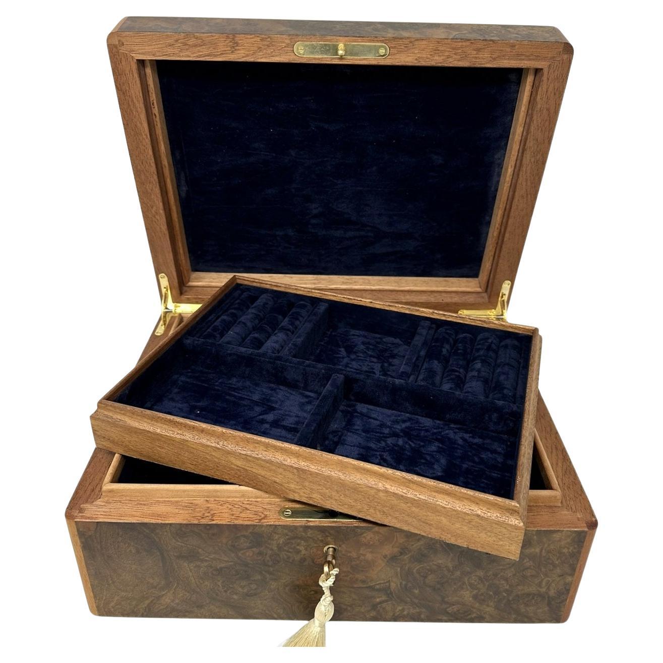 This walnut jewellery casket was manufactured by the famed manning of Ireland company and is truly a jewel of handcrafted genius. This box is constructed of the finest woods available and the knowledge and skill of 4 generations of box making in the