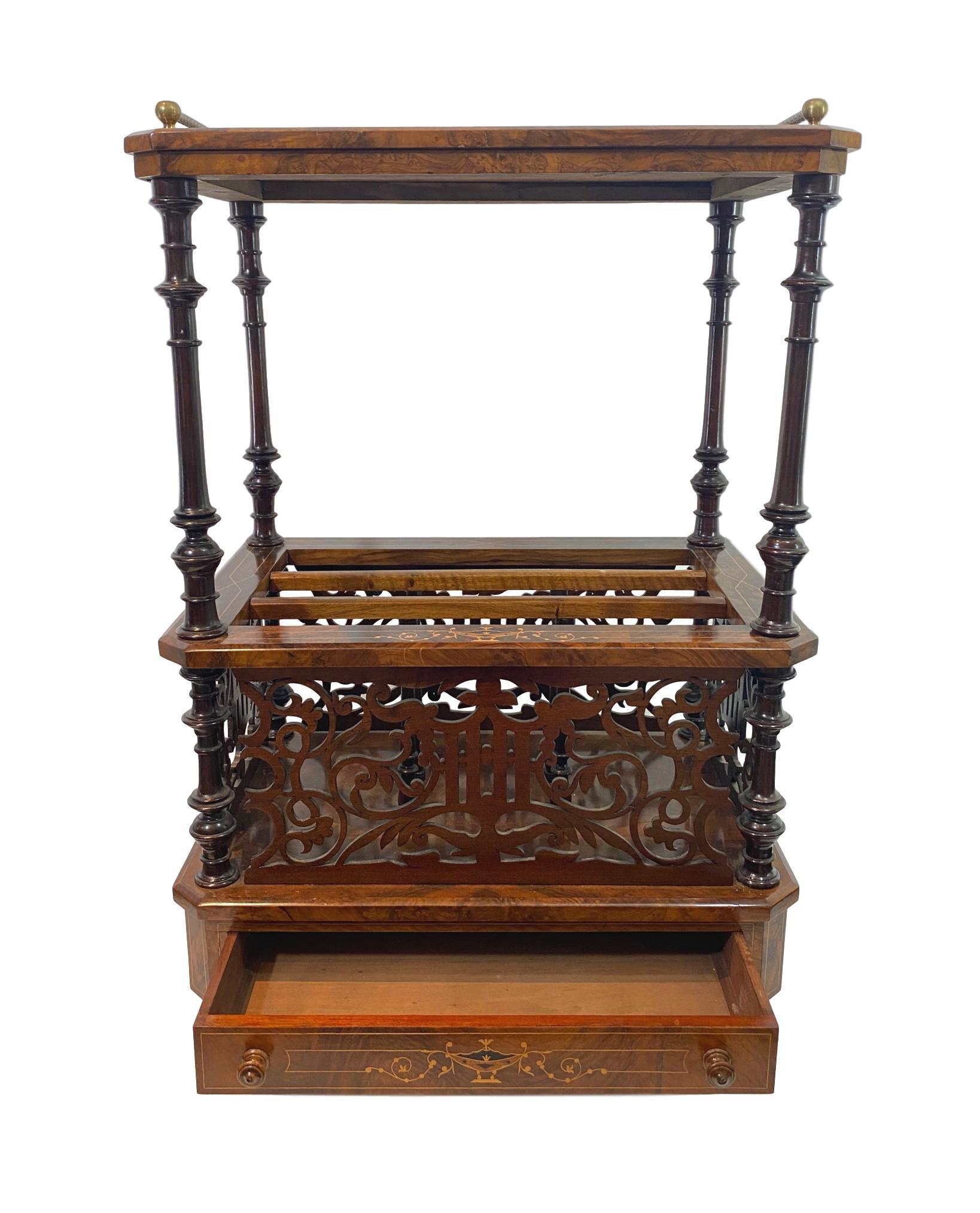 Burl walnut and Marquetry inlaid Canterbury or sheet music stand, English, circa 1880, the highly figured walnut top finely inlaid with ebony and exotic woods forming a central loving cup with stylized floral vines issuing forth, with satinwood