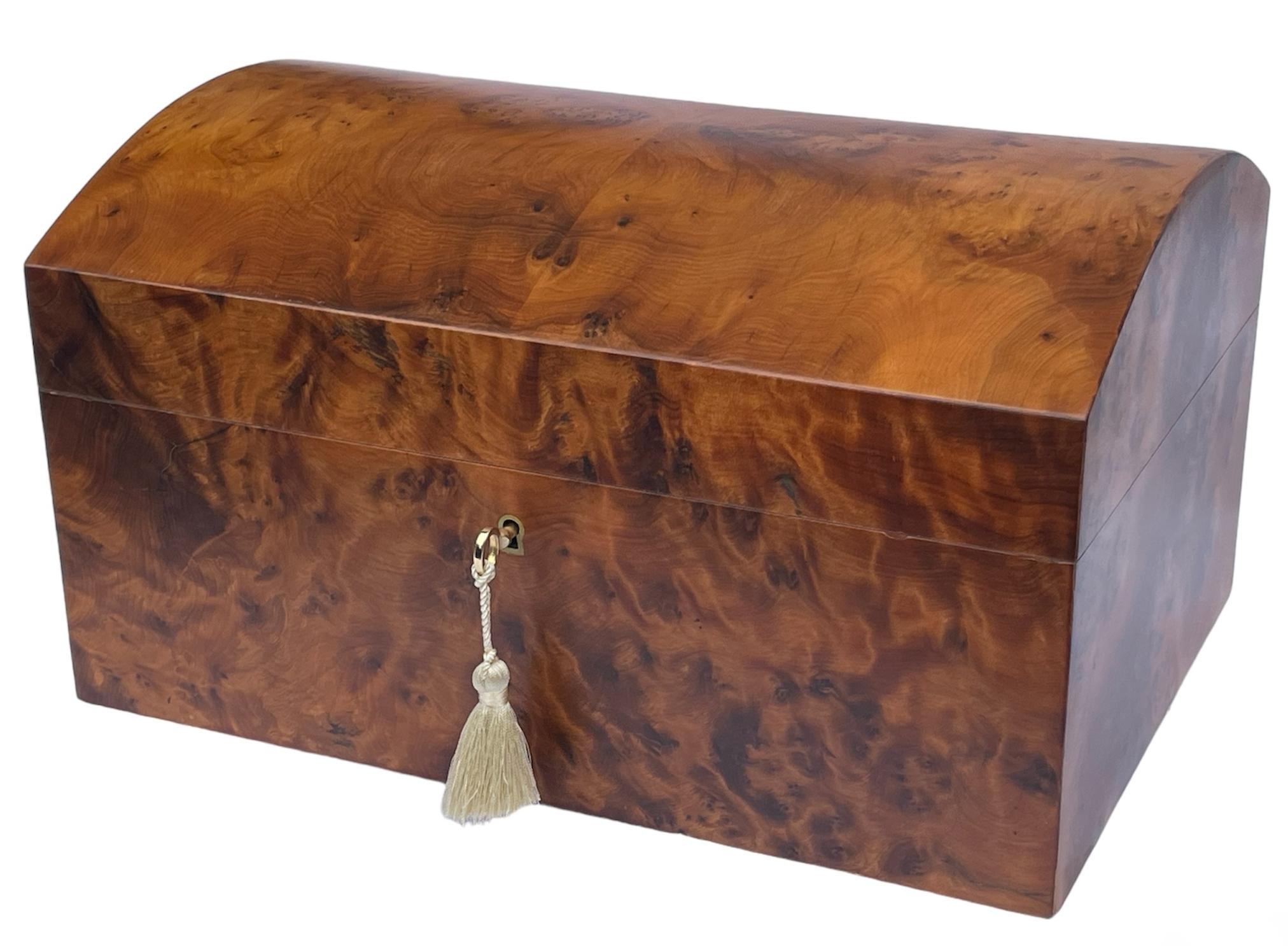 This rare North African Thuya Wood Jewellery Casket was manufactured by the famed manning of Ireland company and is truly a jewel of handcrafted genius. This box is constructed of the finest woods available and the knowledge and skill of 4