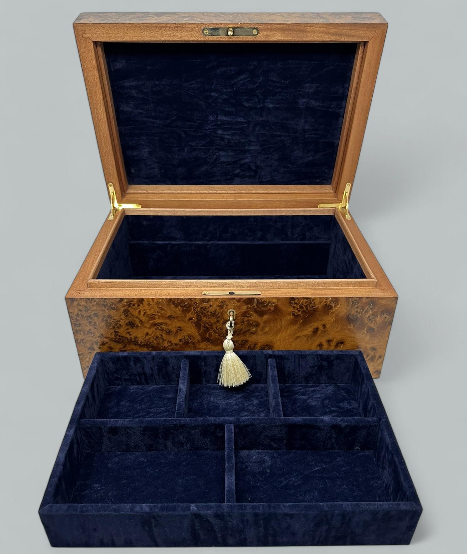 This rare North African Thuya Wood Jewellery Casket was manufactured by the famed manning of Ireland company and is truly a jewel of handcrafted genius. This box is constructed of the finest woods available and the knowledge and skill of 4
