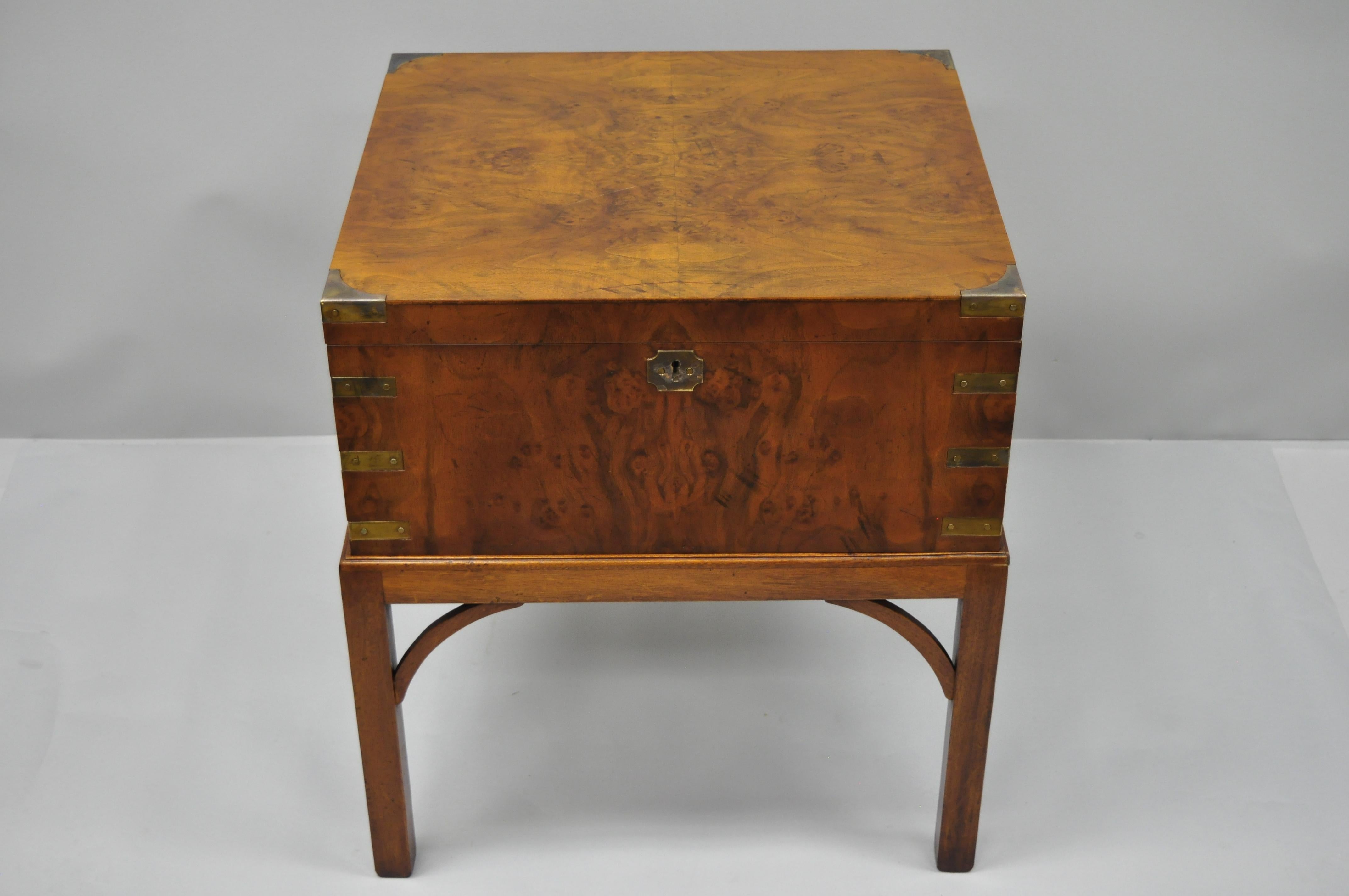 Burl wood Campaign style trunk on stand with brass accents. Item features a lift off box, working lock and key, beautiful burl wood, brass accents, finished on all sides, high quality craftsmanship, circa mid-late 20th century. Measurements: 25