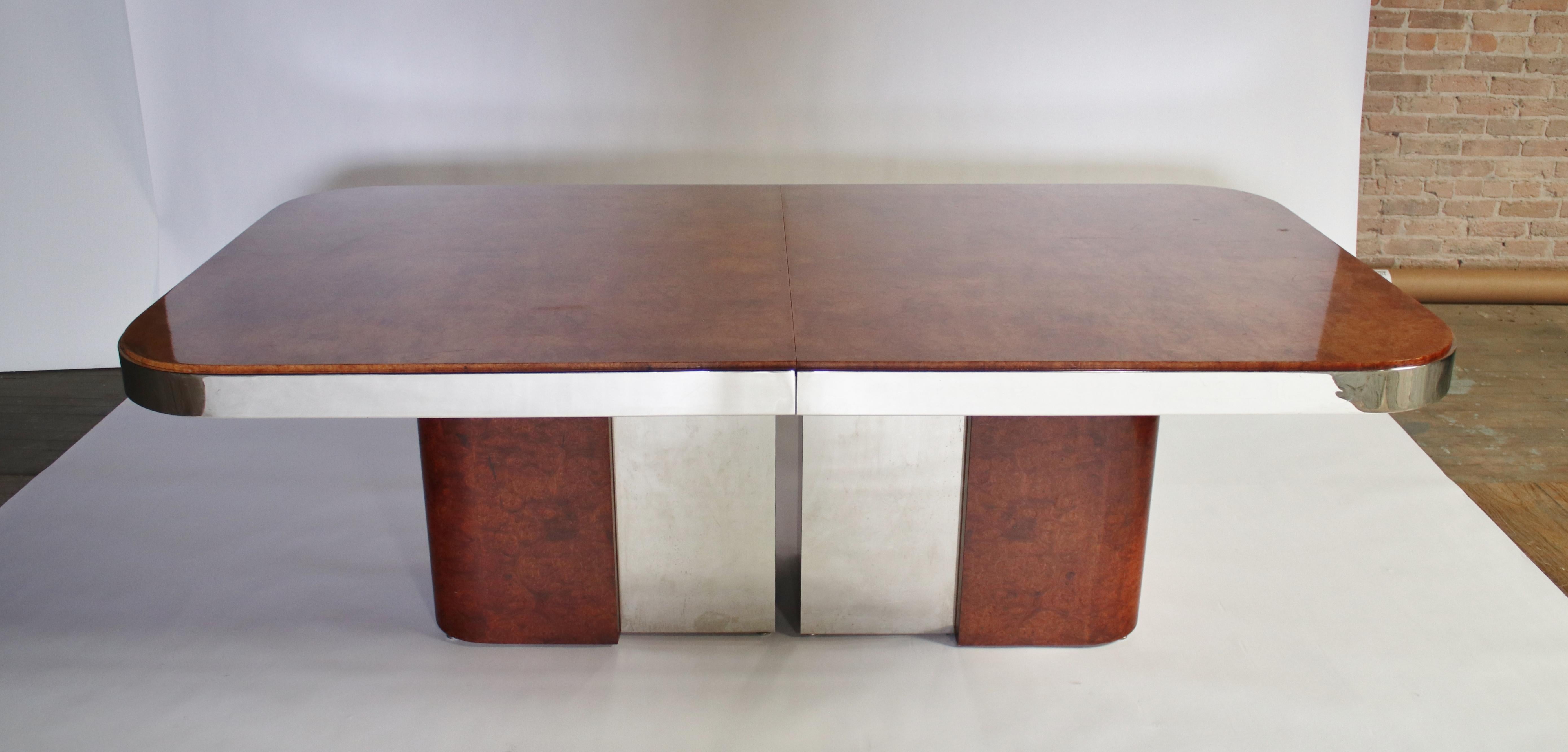 1970s dining table in a gorgeous burl wood with steel racetrack apron by Stanley Jay Friedman for Brueton. 