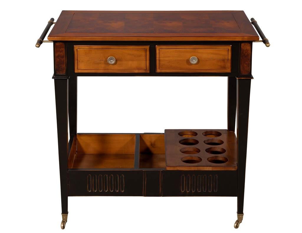 Burl wood bar cart by Baker Furniture. Featuring burl wood details, distressed black accents and metal handles.