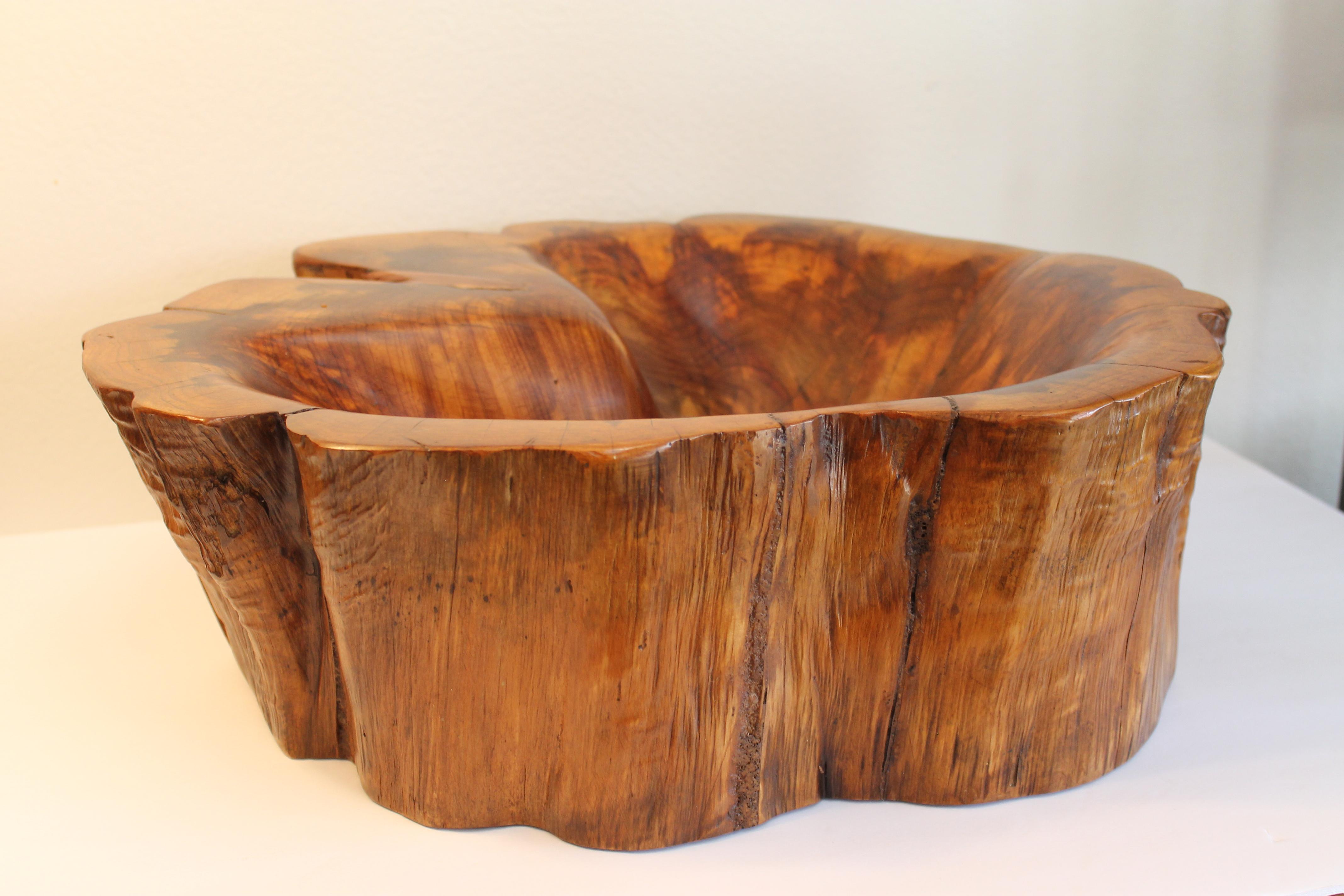 Burl wood bowl. We had the bowl professionally refinished. Bowl measures roughly 19