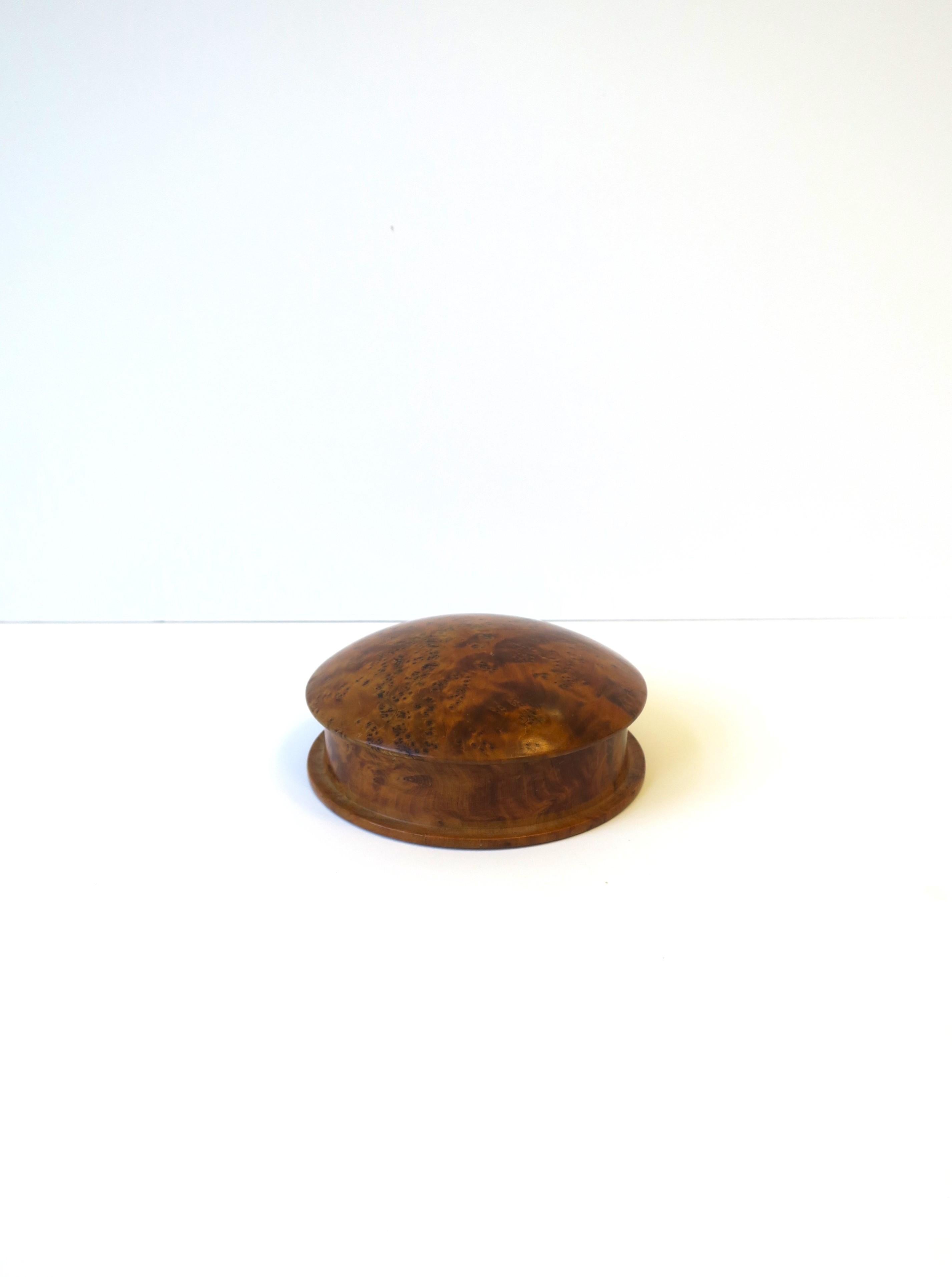 A beautiful round burl wood box. A great piece to hold jewelry or other items. Convenient for a desk, vanity, dresser, walk-in-closet, etc. Excellent condition as shown in images. Dimensions: 5.19