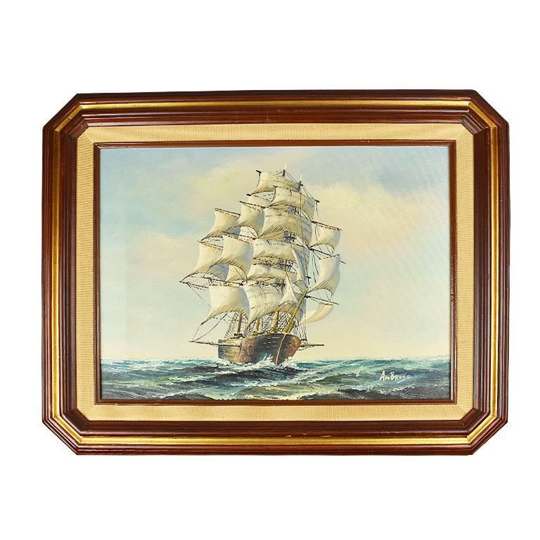 Horizontal painting of a ship at sea. This classical piece depicts a ship at sea amongst blue waves with white caps. Masts are at full sail and the sky is a clear blue with small clouds. The gold frame on this painting is unique in that it has