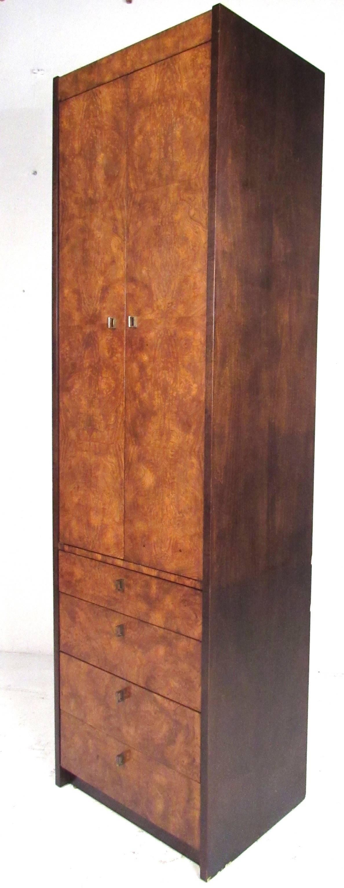 Beautiful, narrow and tall, burl wood cabinet by Century Furniture. Well constructed with four storage drawers below and large shelf storage compartment above. Please confirm item location (NY or NJ) with dealer.


 