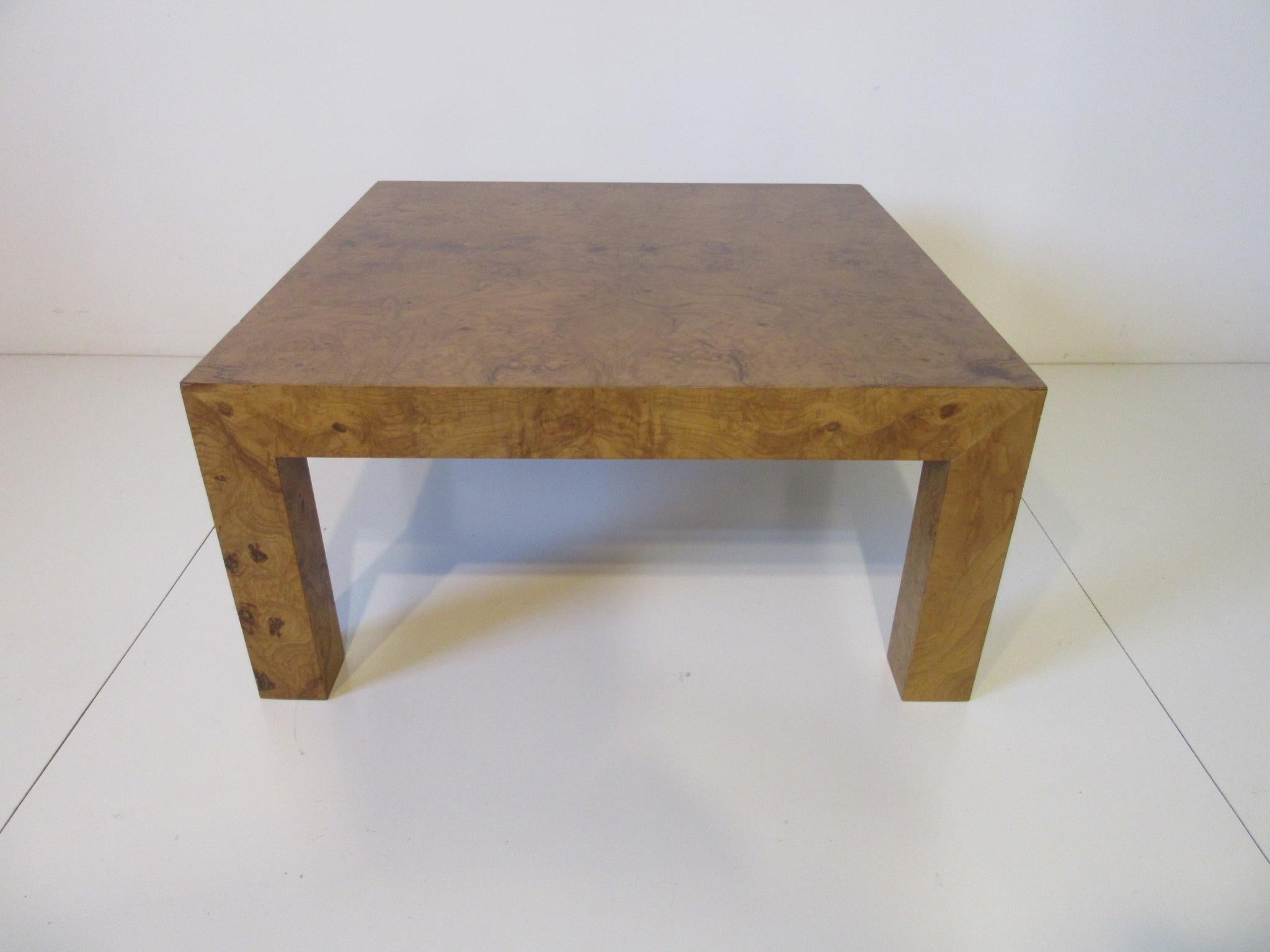 A smaller scale olive wood burl coffee table in the Parson design style, a simple and modern piece that will work with many decors, in the manner of Milo Baughman.