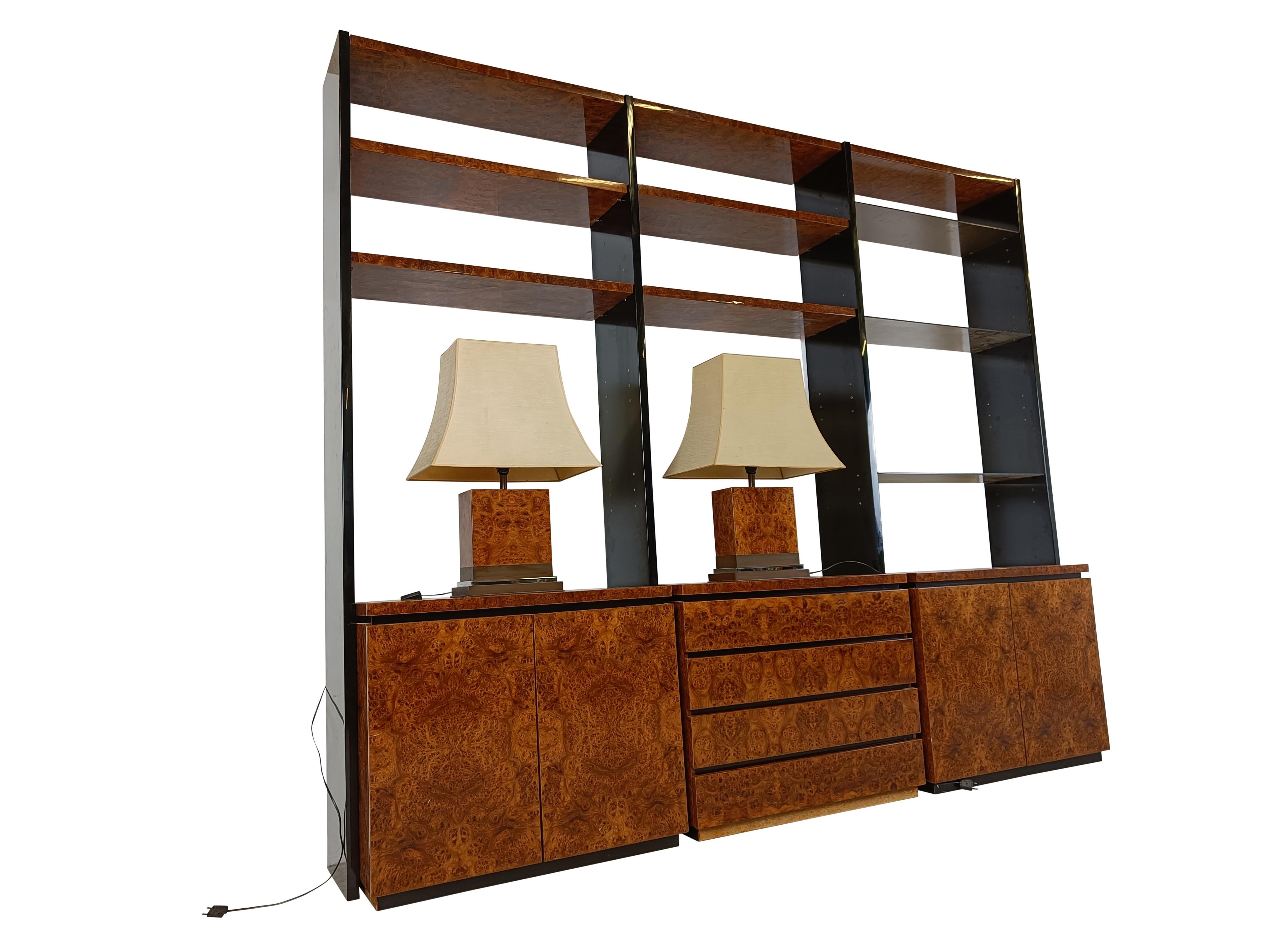 High end vintage wall unit made from burl wood and brass by jean Claude Mahey.

This very rare and luxurious wall unit consists of three cabinets, two with two doors each and one central cabinet with 4 drawers.

There are also 4 burl wood shelves