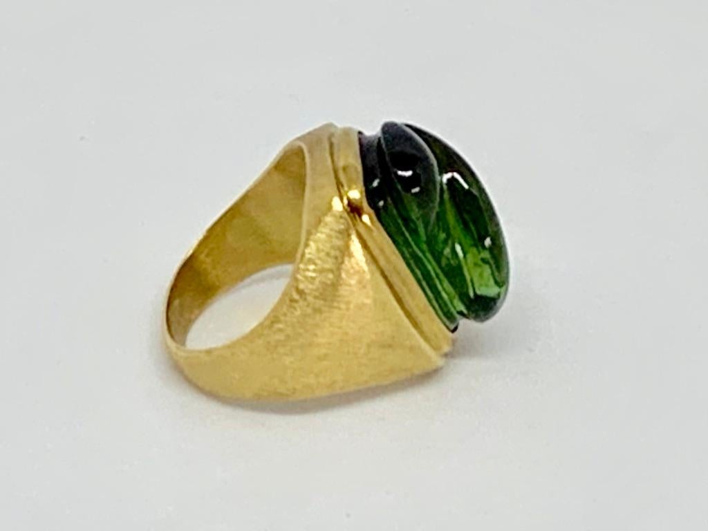 Thanks for taking a look at this Burle Marx Free Form Green Tourmaline Ring surrounded by 18 Karat Gold. The stone is .65