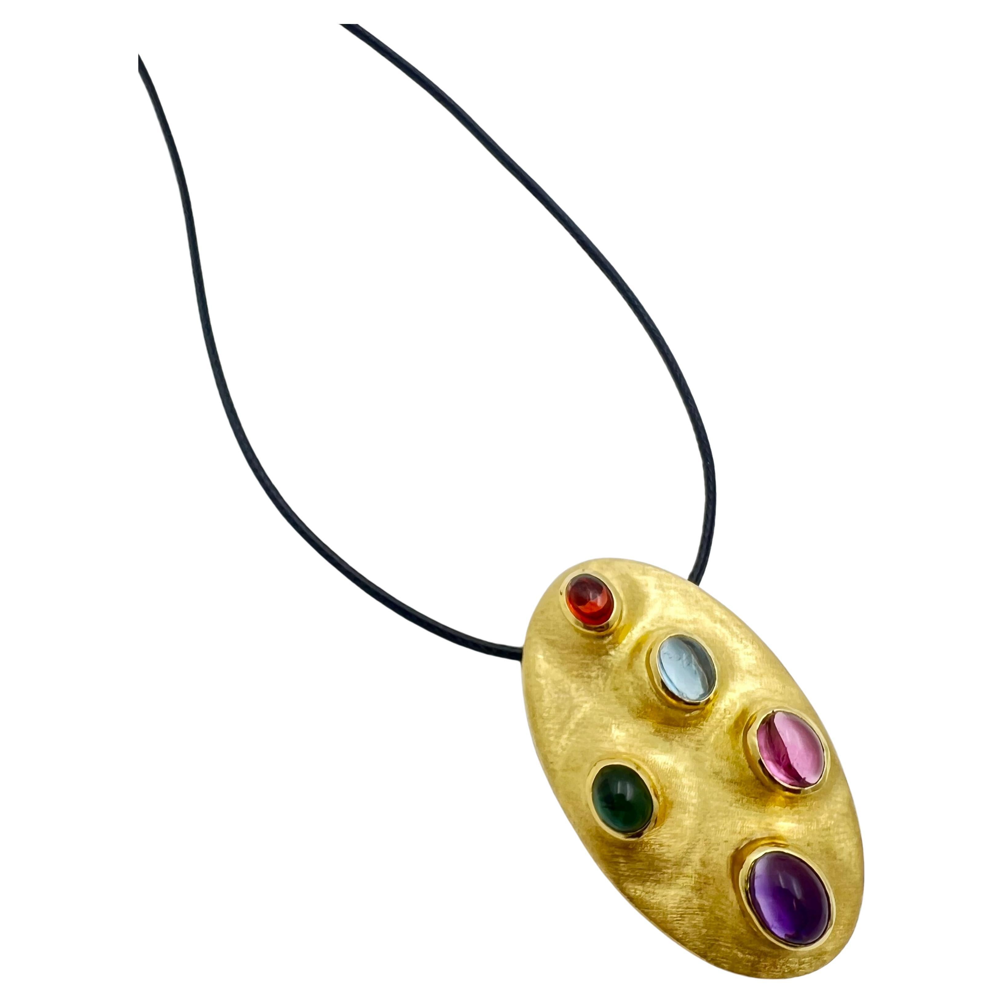 Contemporary design brooch in 18k yellow gold and multi-color gemstones by Brazilian designer Burle Marx. Hand crafted brushed satin finish, bezel set with five oval cabochon cut Brazilian natural gemstones including amethyst, pink tourmaline,