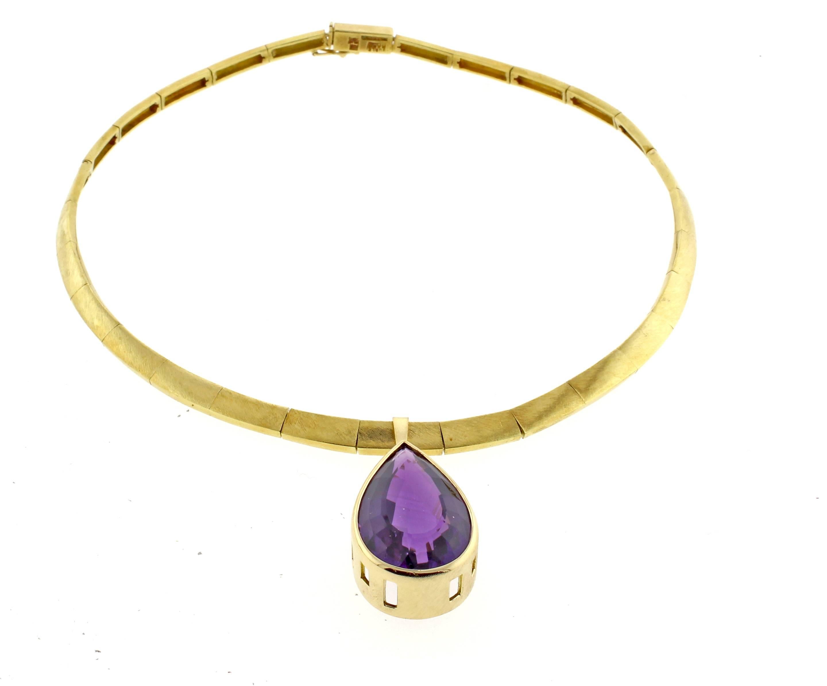 From world renowned Brazilian jeweler Haroldo Burle Marx (1911-1991,) an amethyst and gold necklace. The detachable amethyst drop measures  32*22mm. The 16 inch gold necklace is 3/8 of an inch wide. 