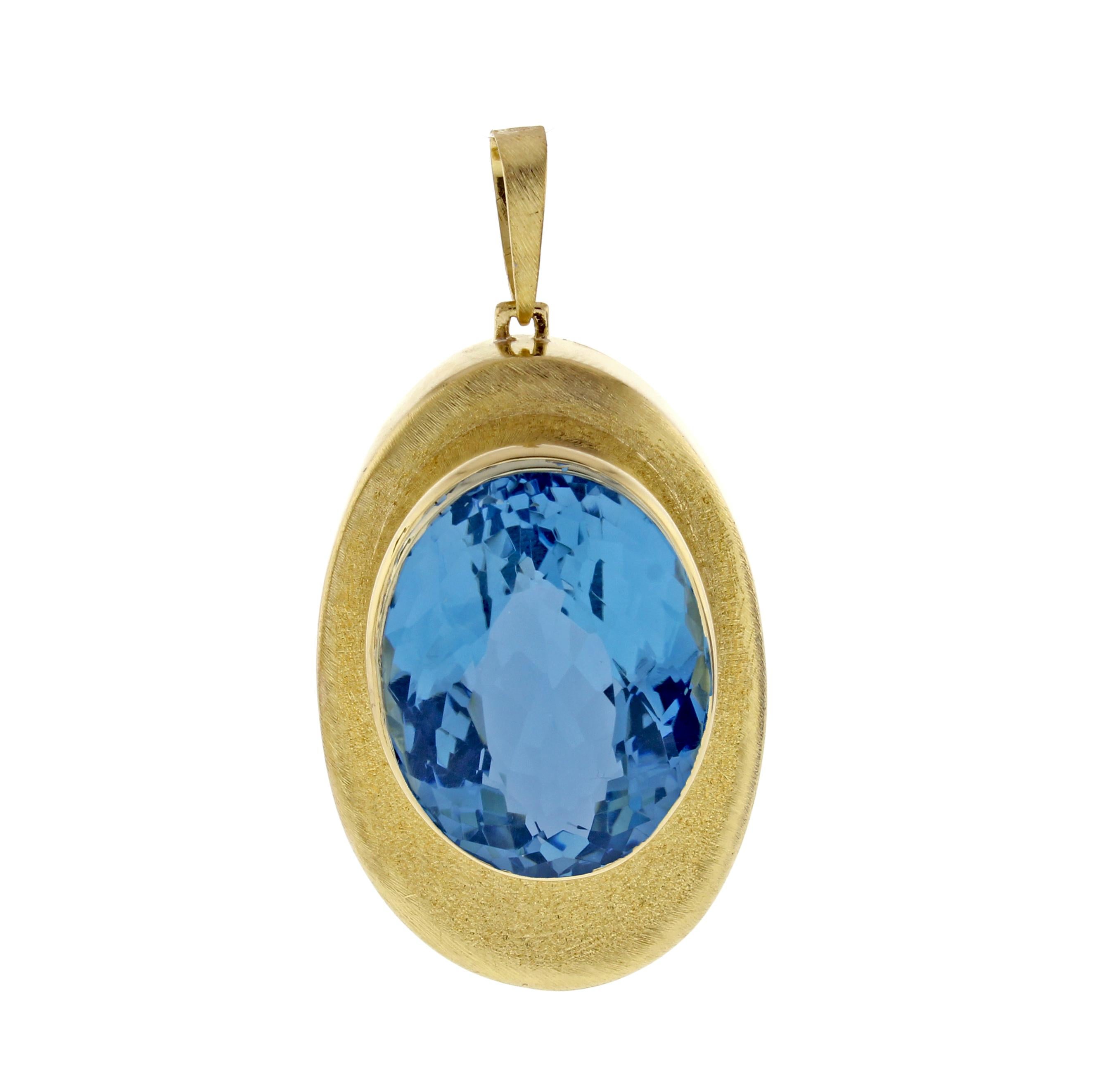 From world renowned Brazilian jeweler Haroldo Burle Marx (1911-1991), a blue topaz and 18 karat gold pendant   The pendant measures 45*35mm with the blue topaz measuring 21*28mm