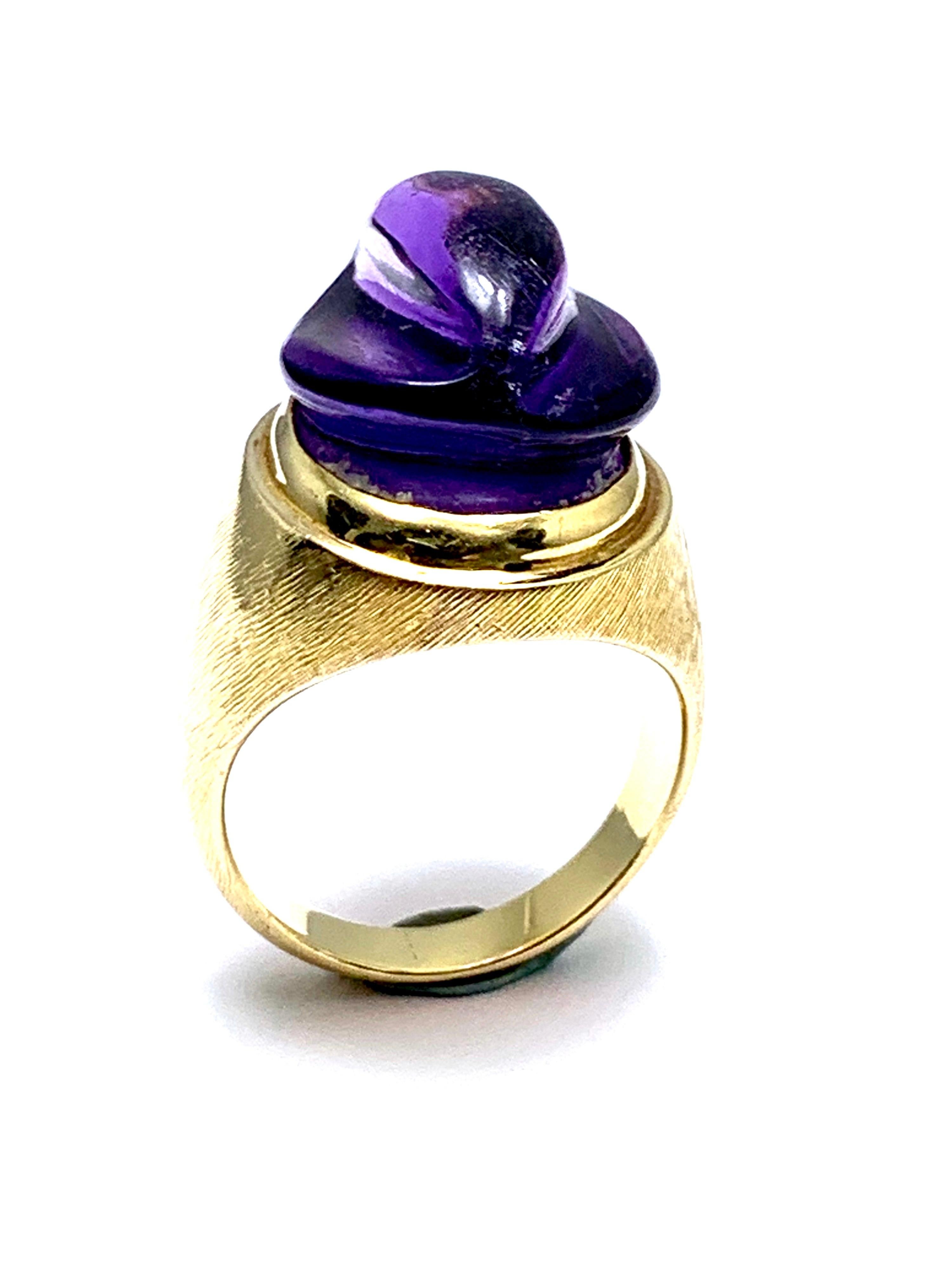 A gorgeous Amethyst Forma Livre ring designed by Burle Marx. The 11.38 carat custom cut Aquamarine displays a rich purple hue, bezel set in an 18 karat yellow gold abstarct design ring. The inside shank is signed 