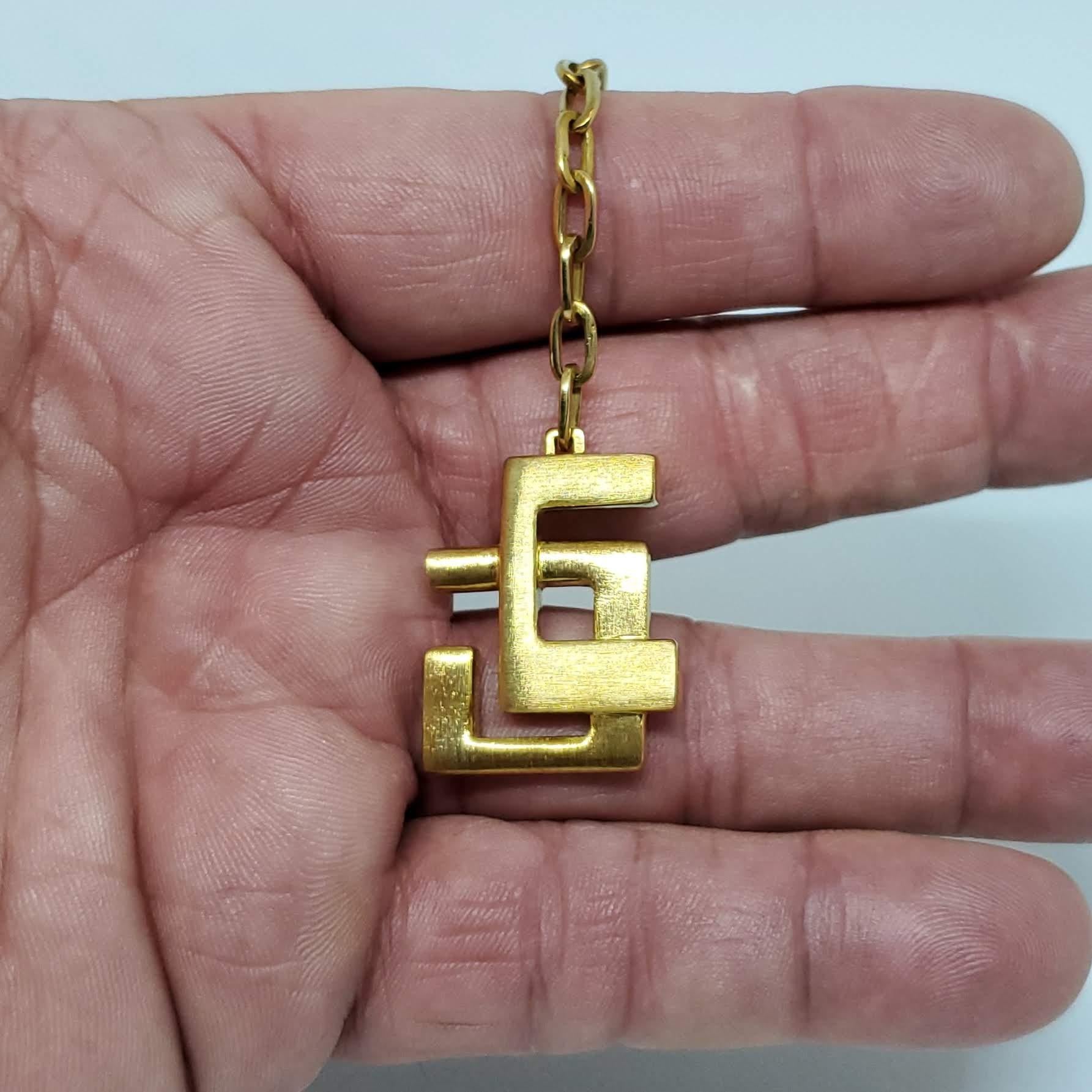 Here's a Burle Marx piece you'll likely never see again. Haroldo made this for me for my 18th Birthday. I put a key on it maybe twice. It's too beautiful to use! It's total length is just a tad over 4.5 inches. The medallion is 1.13 inches long, and