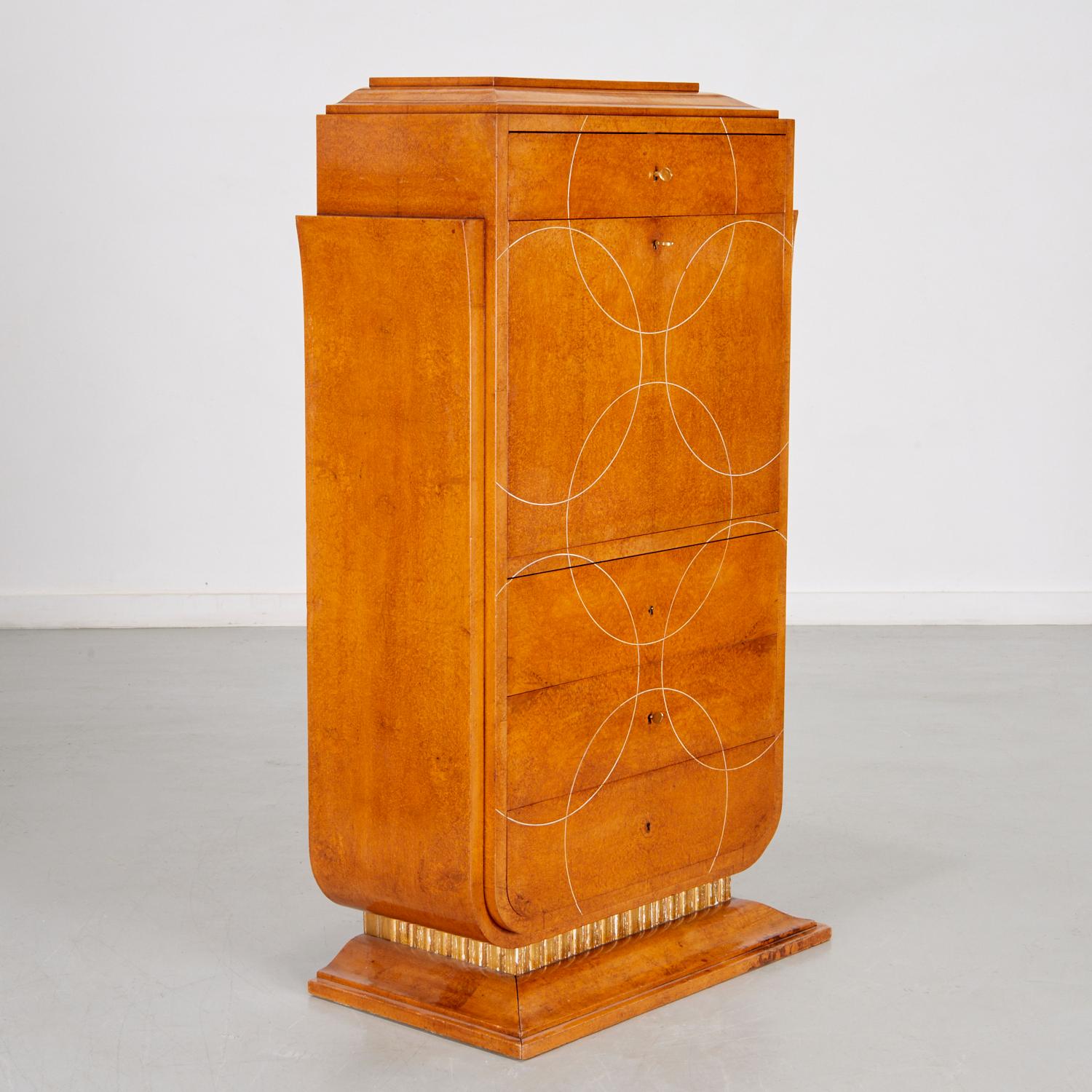 Burled elm Art Deco period secretary cabinet attributed To Rene Herbst. the front decorated with looping thread inlay, drop down door opening with inset with cognac colour leather writing surface and bird eye maple sectioned storage and drawers,