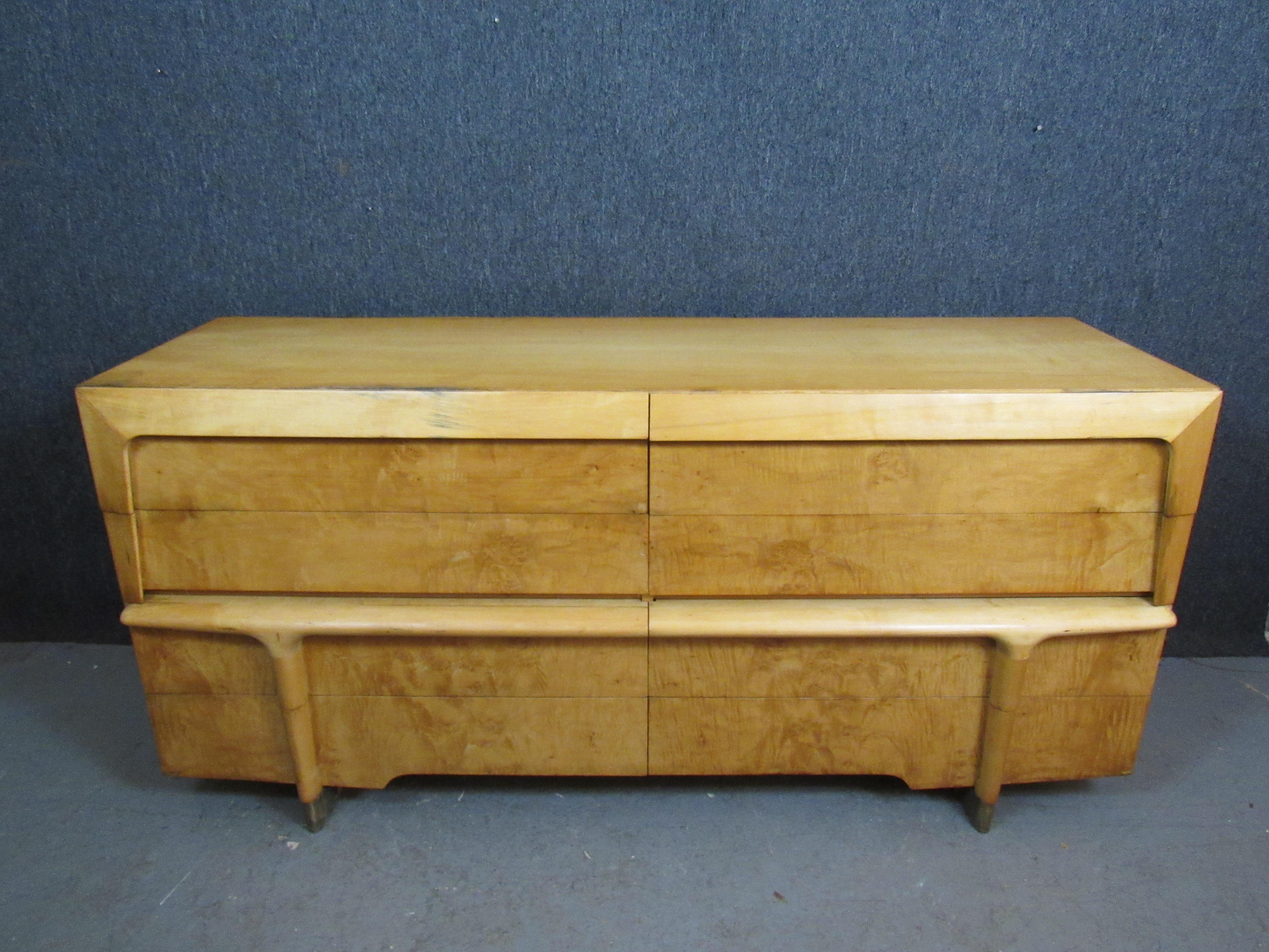 Exceptional lowboy dresser in the unmistakable style of Massachusetts' Heywood Wakefield furniture. A beautiful burled maple veneer elevates the piece to a higher tier of luxury design. Four large lower drawer pull out for ample storage of blankets,