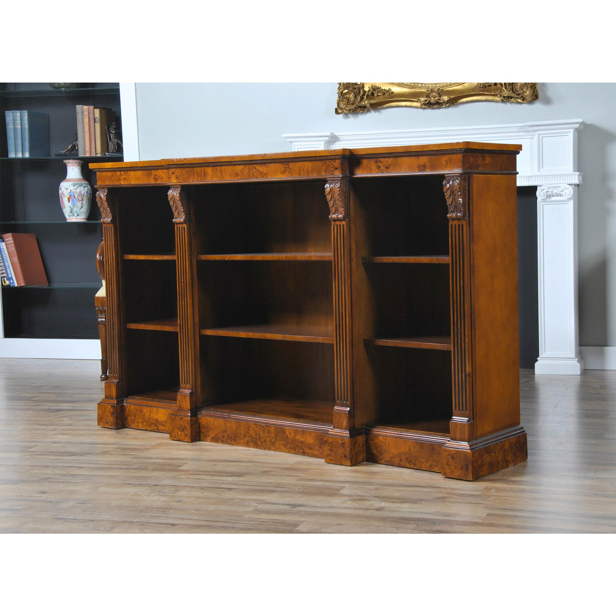 The Niagara Furniture Burled Penhurst Bookcase has a burled veneer top which is banded and supported by a burled cornice that is both beautiful and adds a sense of depth to the upper area of the case. The hand carved acanthus, solid mahogany