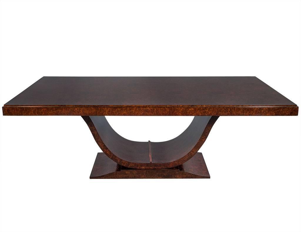 Burled walnut Art Deco inspired dining table by Aerin Lauder. Designed by Aerin, this elegant Art Deco silhouette defines this gorgeous table. Featuring a rich cocoa finish, hand rubbed to a satin soft gloss. Clean lines with sleek curves, this