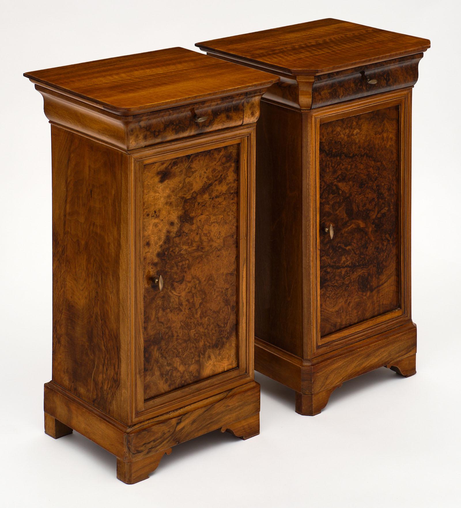 French Antique burled walnut side tables featuring a striking, lustrous French polish finish. The wood is in excellent antique condition, and we love the details of the pair. One features curved corners, while the other has cut corners. Each has a