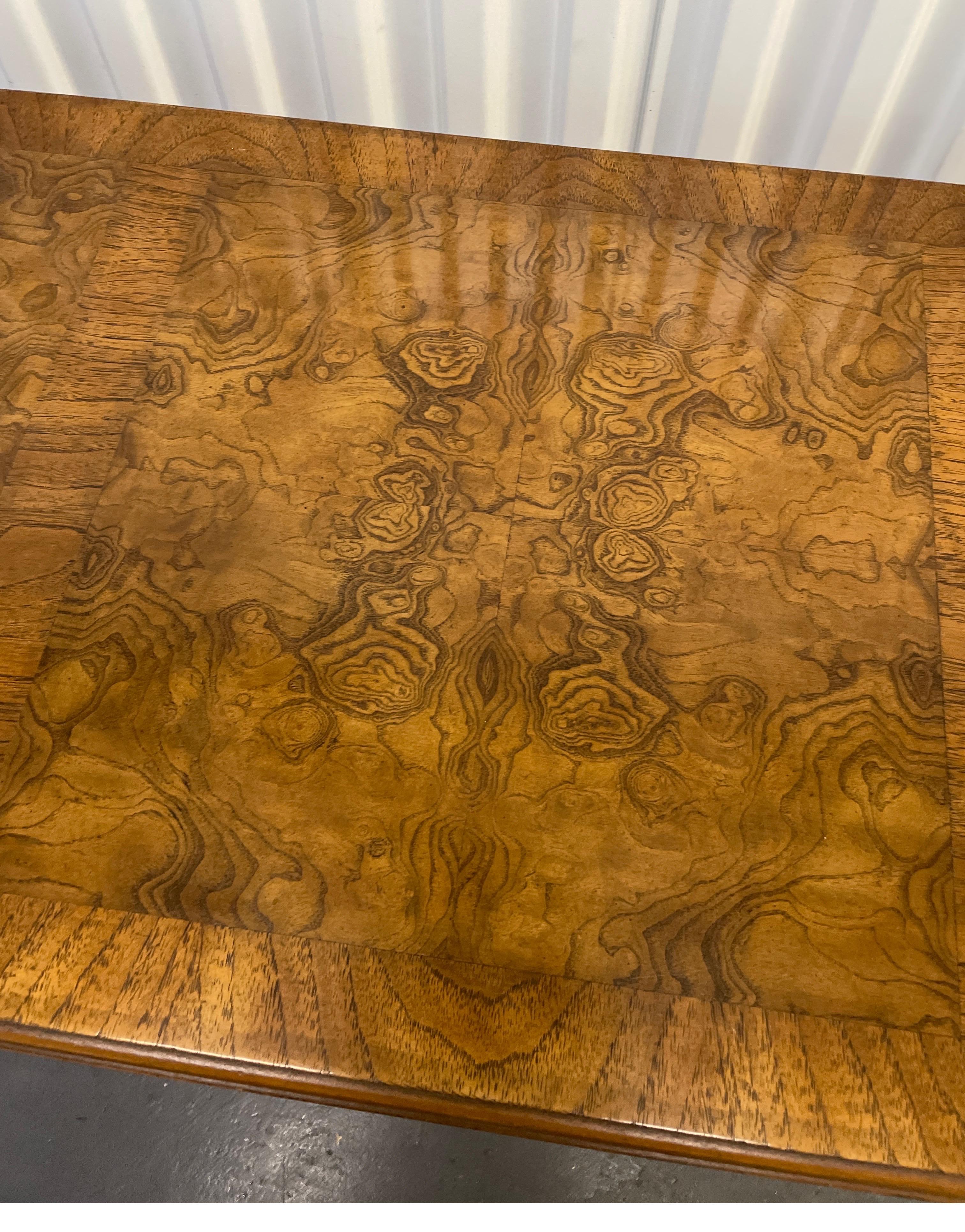 Small single drawer burlwood desk with cabriole legs.