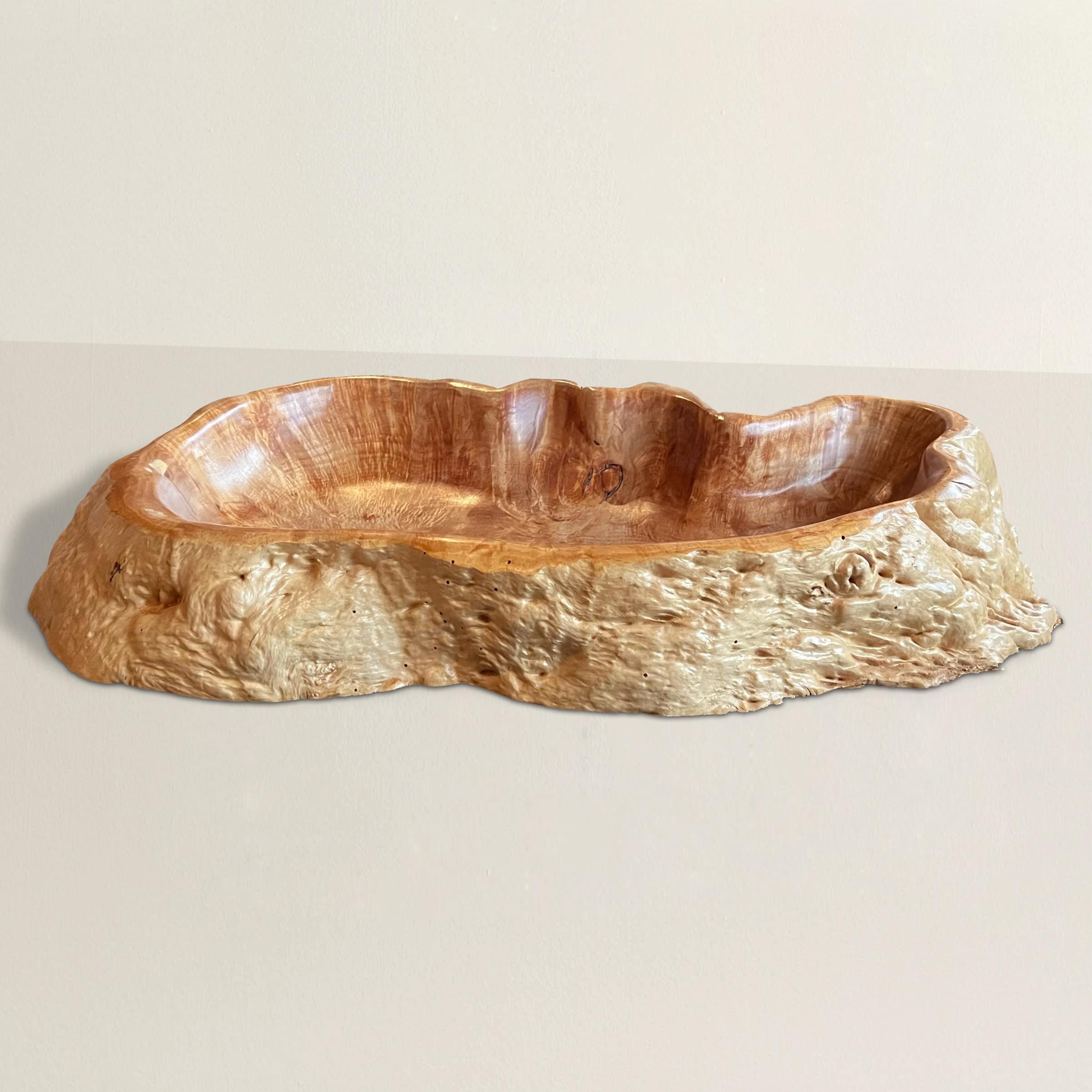 A stunning 21st century hand-carved burl wood tray of rather large size, and perfectly designed to hold your keys, sunglasses, remote controls, or any other odds and ends you have lying around the house.  