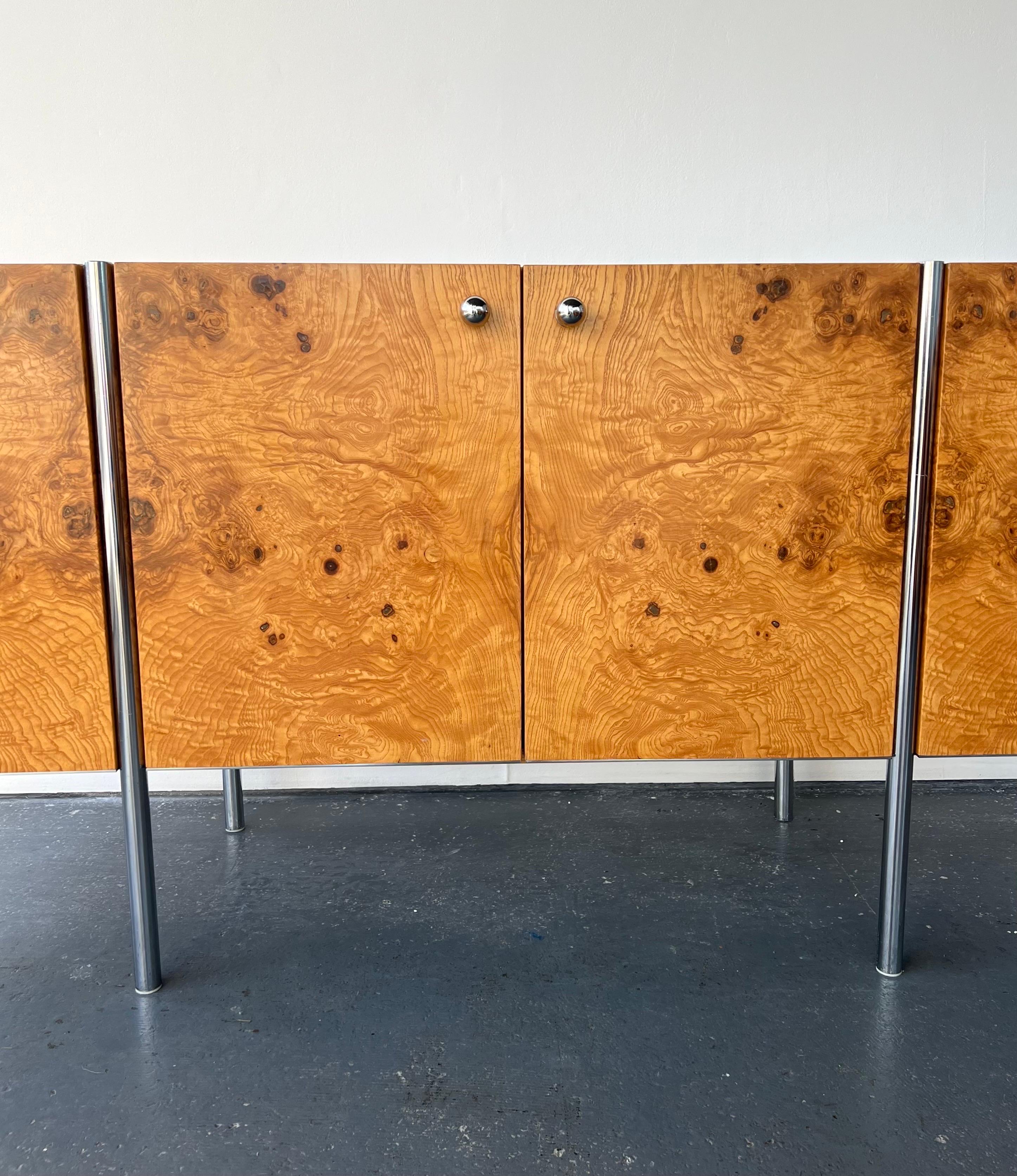 A Walnut and Chrome midcentury Sideboard custom made. This fabulous vintage sideboard is superb quality and has lovely chrome handles and legs which are in very good condition. There is no maker label and there is no match online therefore we