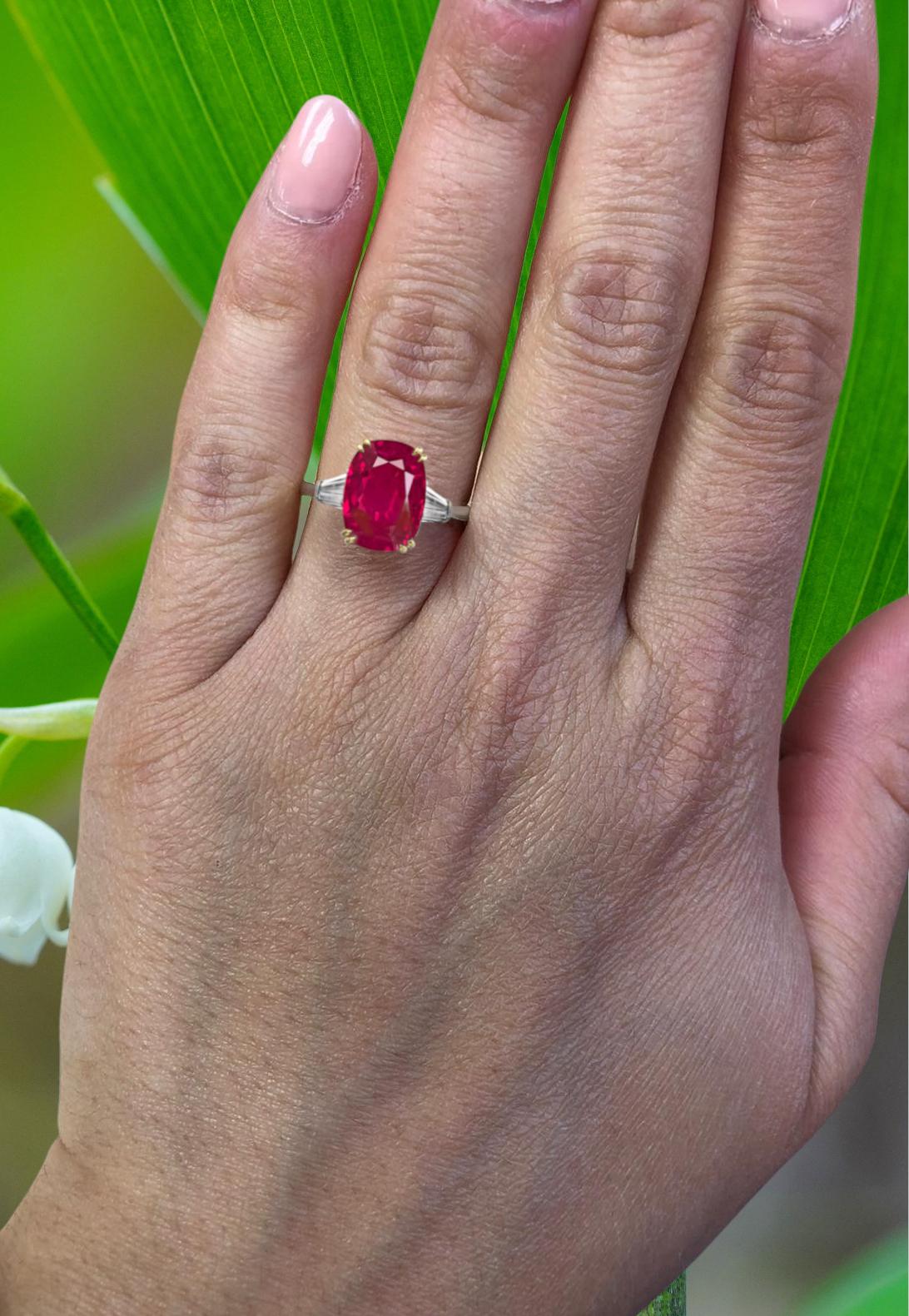Very fine no heat Burma ruby. It is GII certified stating that it is not heated or enhanced in any way, and falls in the rare category of being called 'Classic' Burma. 

The oval ruby weighs 3.48 carats, and is flanked by 2 tapered baguette cut