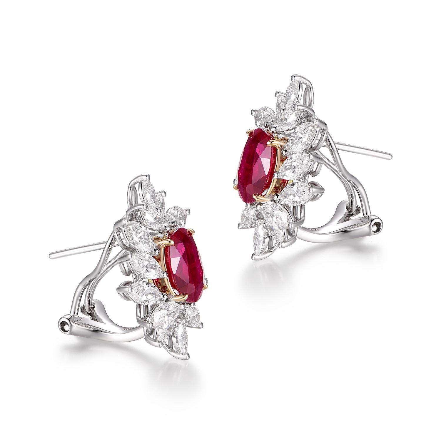 A striking embodiment of luxury and elegance, these exquisite earrings are truly a masterpiece in the realm of fine jewelry. Crafted meticulously from 18K white gold, they showcase the richness and depth of a captivating 2.98ct Burma ruby, GIA