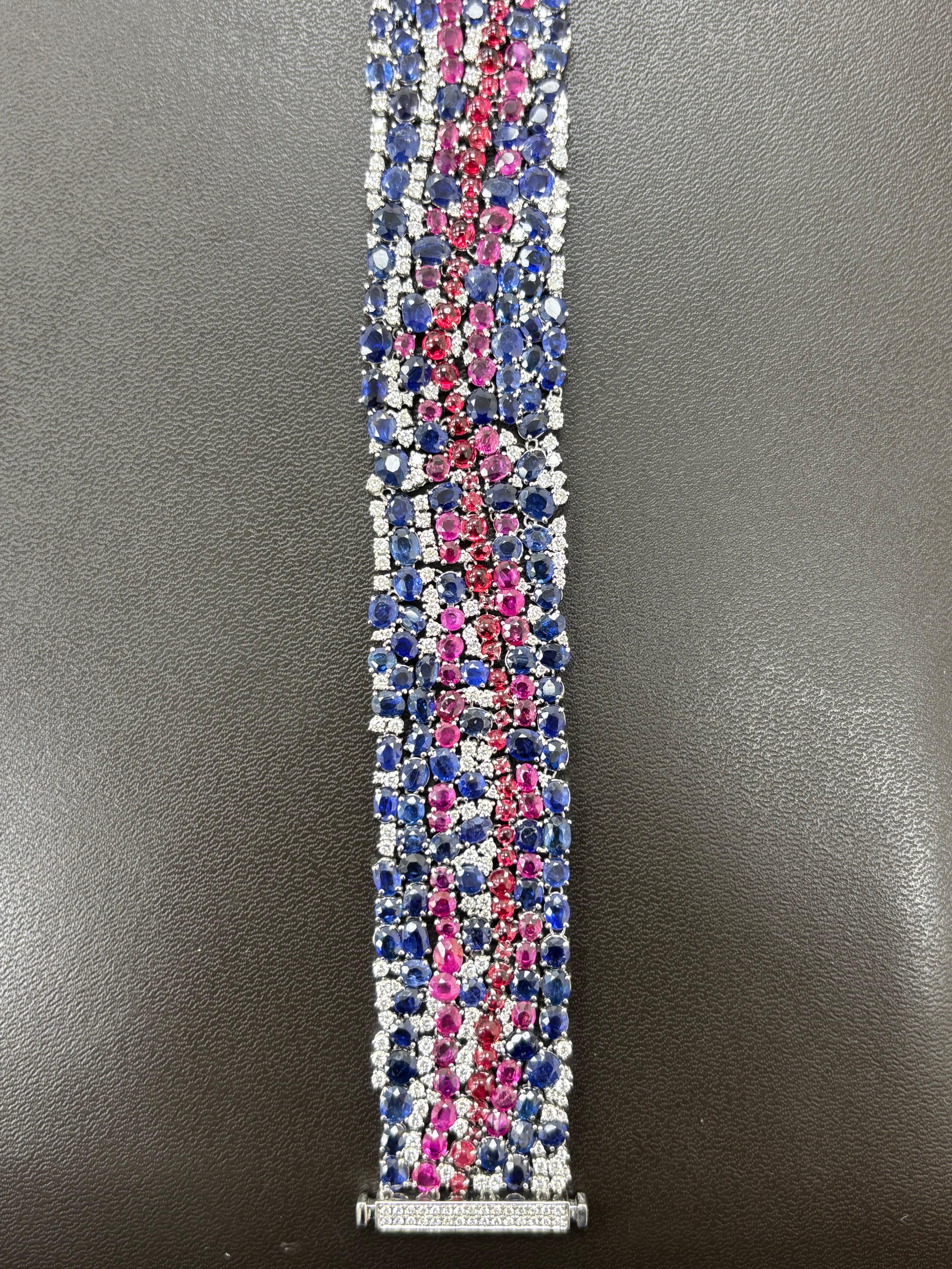 This exceptional bracelet is a rare and prestigious masterpiece, showcasing an extraordinary selection of untreated Burmese blue and pink sapphires, and spinels, meticulously arranged in an intricate platinum setting. The gemstones, all natural and