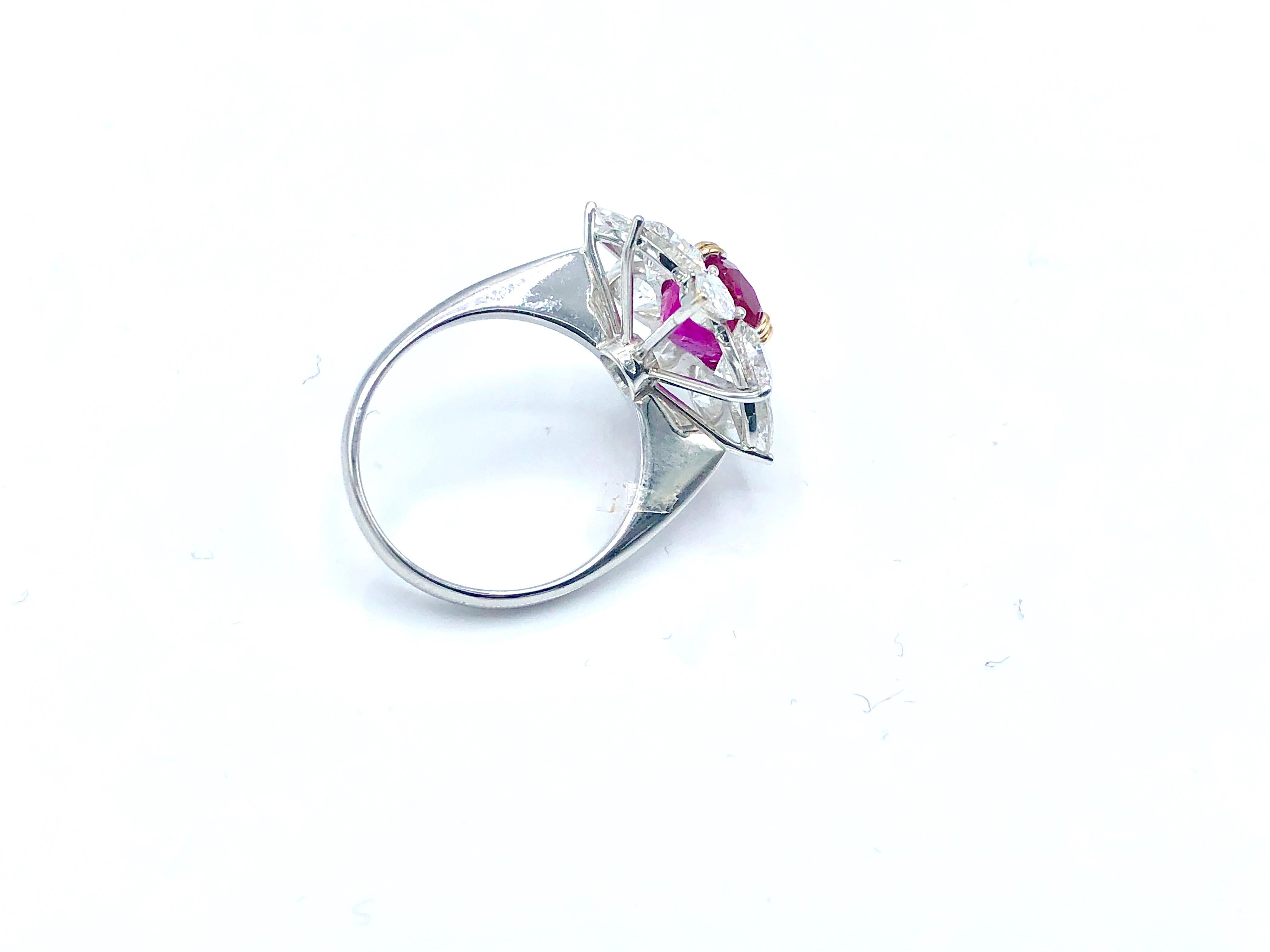A timeless ring set with a rare 3.38 ct Burmese unheated ruby surrounded by fancy cut diamonds (3.08 ct)

Size : US 6, IT 12, FR 54