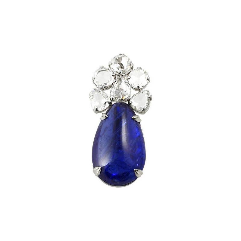 A beautiful natural, no heat pear-shape sapphire set with three round and three pear-shape rose cut diamonds, set in Platinum. The sapphire weighs 12.77 carats with a total diamond weight of 2.04 carats.
