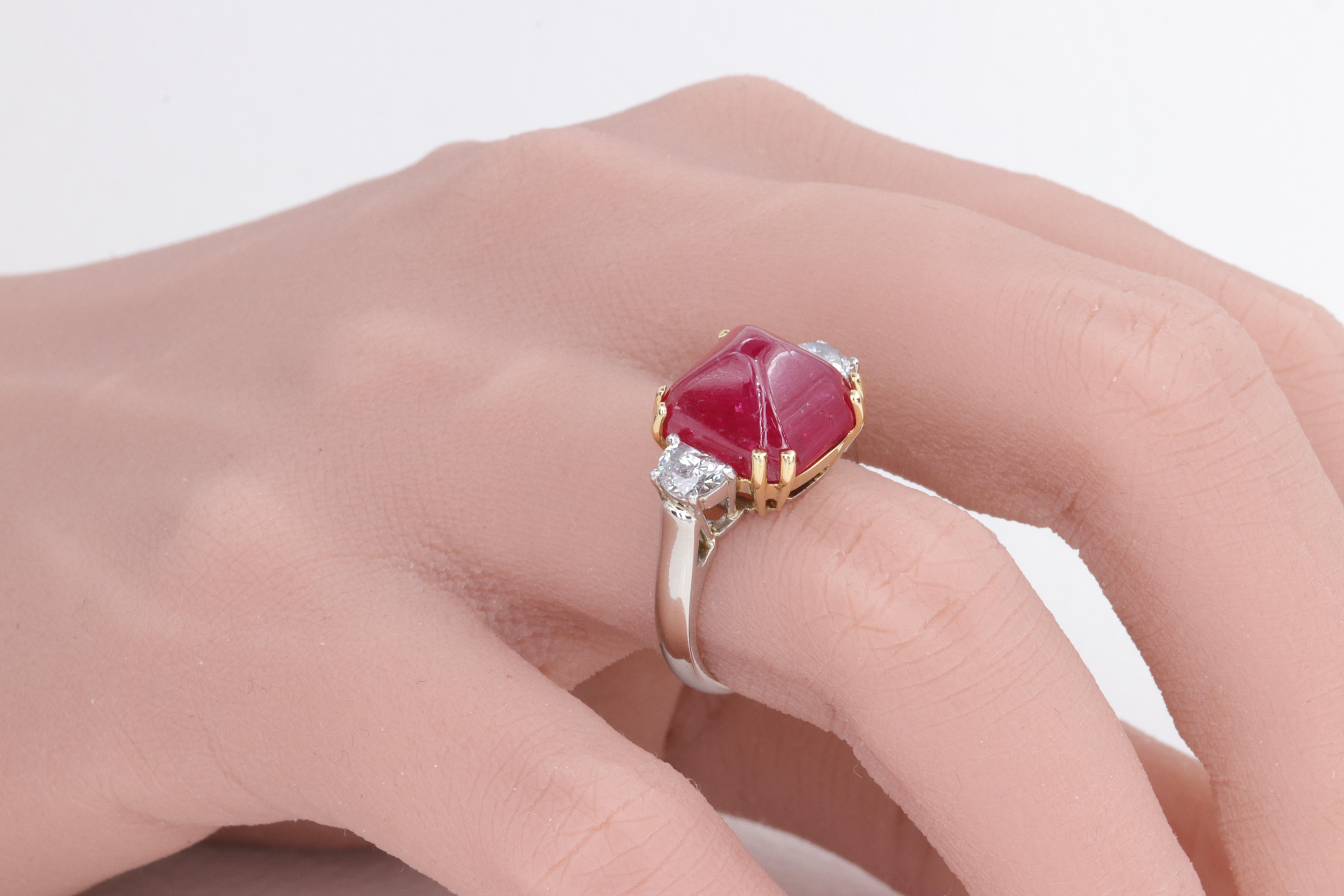 11.24 Carat Burma No Heat Ruby Sugar Loaf & Half Moon Cut Diamond 3 Stone Ring

Featuring a rare and large 11.24 carat sugar loaf ruby with gorgeous vivid red color certified by the Gemological Institute of America (GIA) as having a Burma origin and